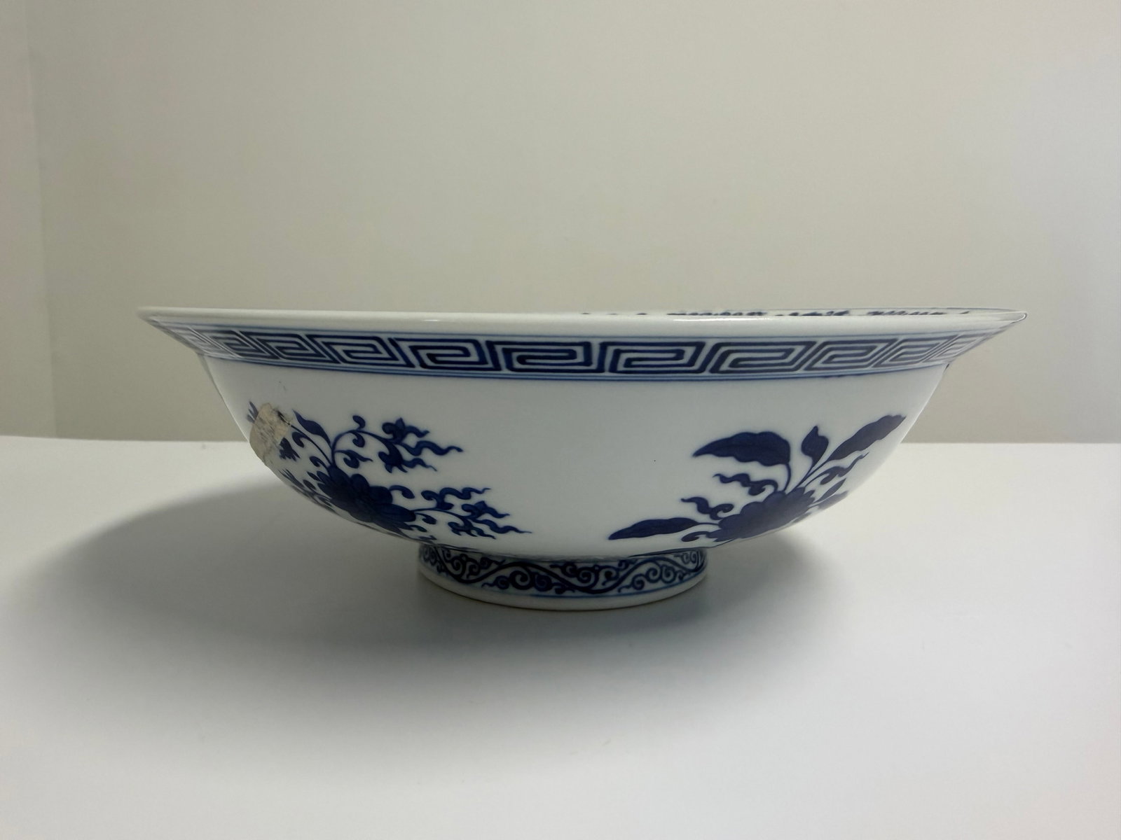 Chinese blue and white flowers porcelain foot bowl with mark: Dimension: 10 inches , please note Due to manual measurement, dimensions may vary. Condition: Good used condition, please note buyers are obligated to come to the site to inspect the condition and det