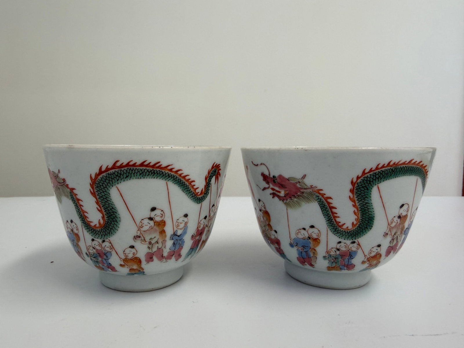 Pair of Chinese enamel famille rose kids porcelain cups with mark: Dimension: 3.25x2.5 inches , please note Due to manual measurement, dimensions may vary. Condition: Good used condition, please note buyers are obligated to come to the site to inspect the condition