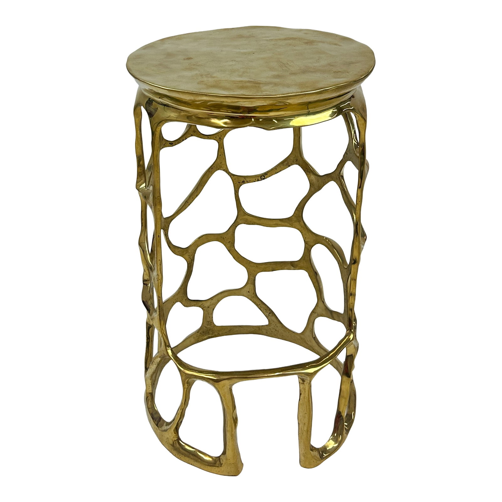 Peru Sculptural Brass Counter Stool: The Peru Brass Stool stands 24 inches tall and brings an artistic, inviting glow to any room. Handcrafted from solid brass, its openwork frame features an organic, flowing pattern that feels both airy