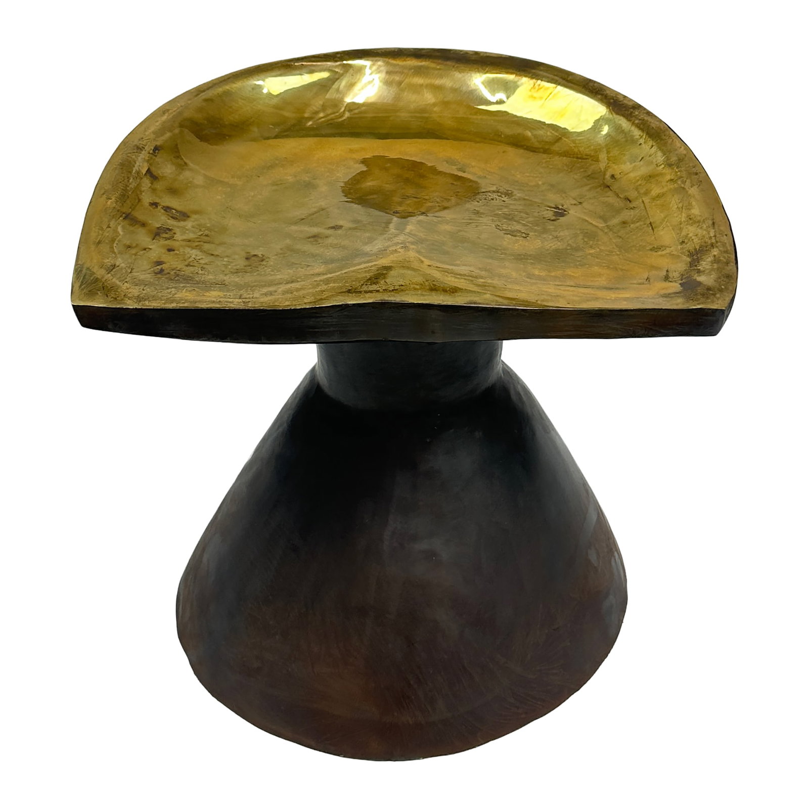 Sita Sculptural Brass Accent Stool: The Sita Brass Stool stands 17.5 inches tall and beautifully blends warmth with modern artistry. Its hand-sculpted brass seat shimmers with a soft golden glow, resting atop a dark, flared base that