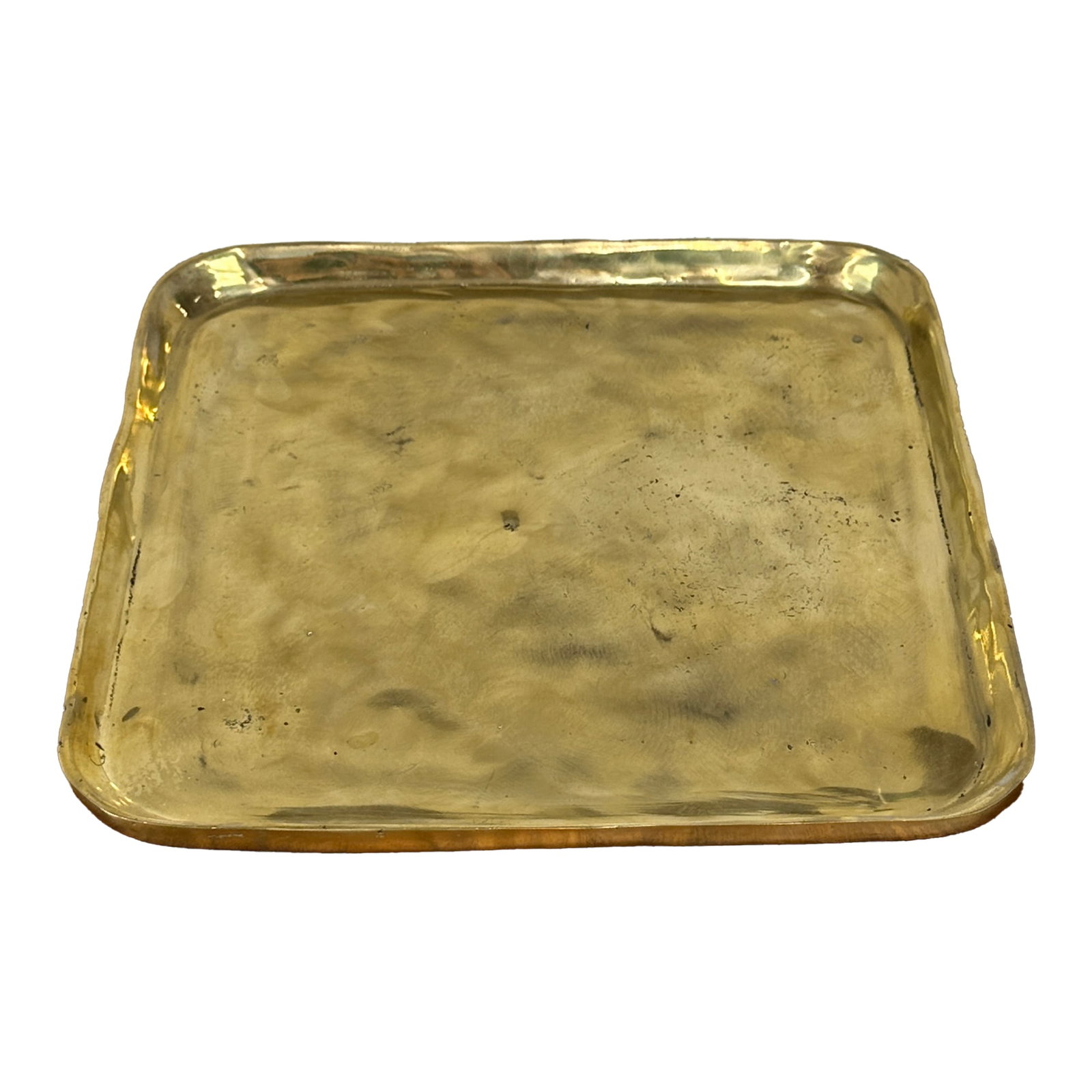 Handcrafted Square Brass Decorative Tray: A beautiful square brass tray featuring soft, rounded corners and a gently raised rim. The surface shows natural variations and subtle imperfections that add to its handmade appeal. This piece functio