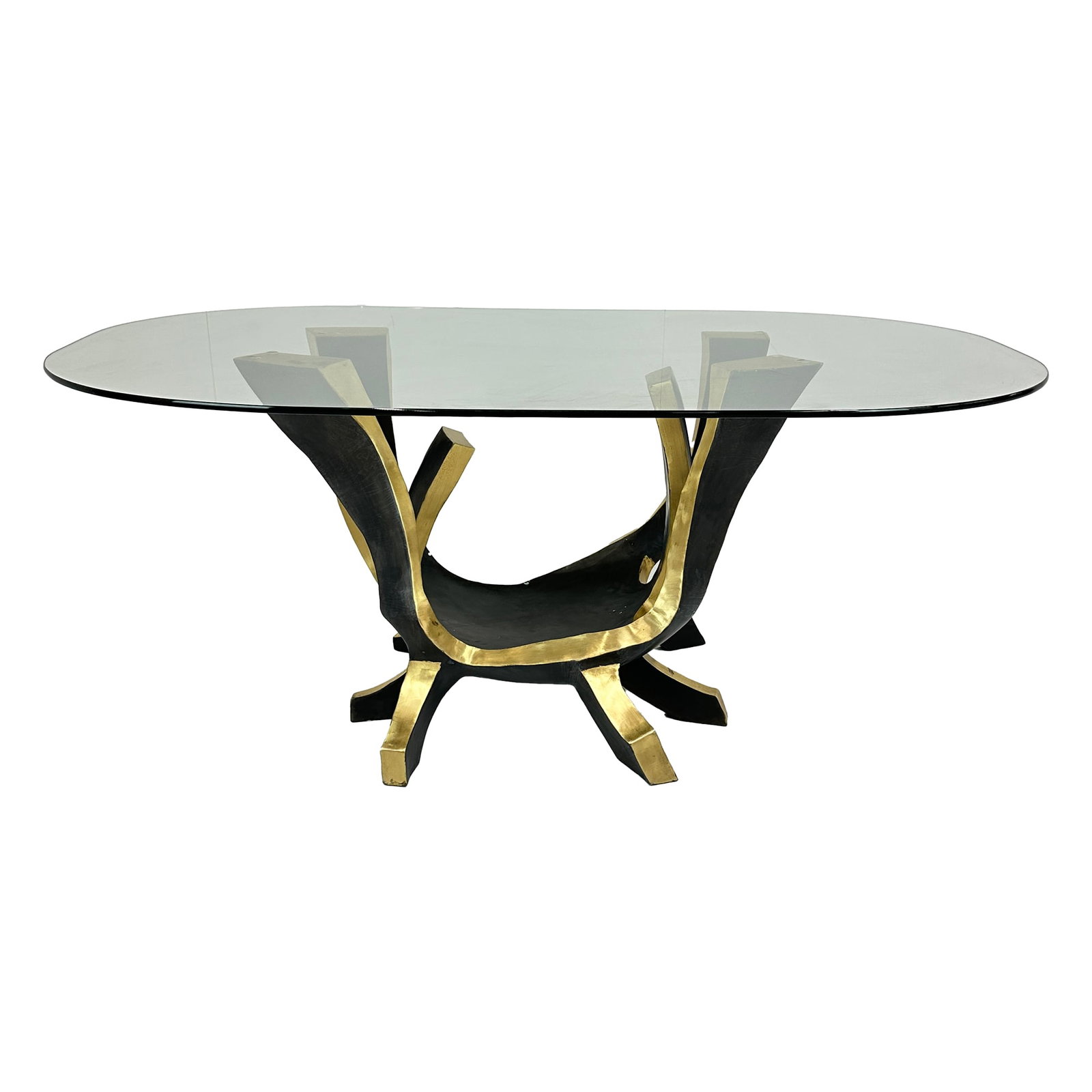 Magnolia Brass Black & Glass Dining Table: The Magnolia Dining Table features a sculptural base crafted from solid brass with bold black accents, forming a dynamic, organic structure that supports a sleek glass top. The interplay between the