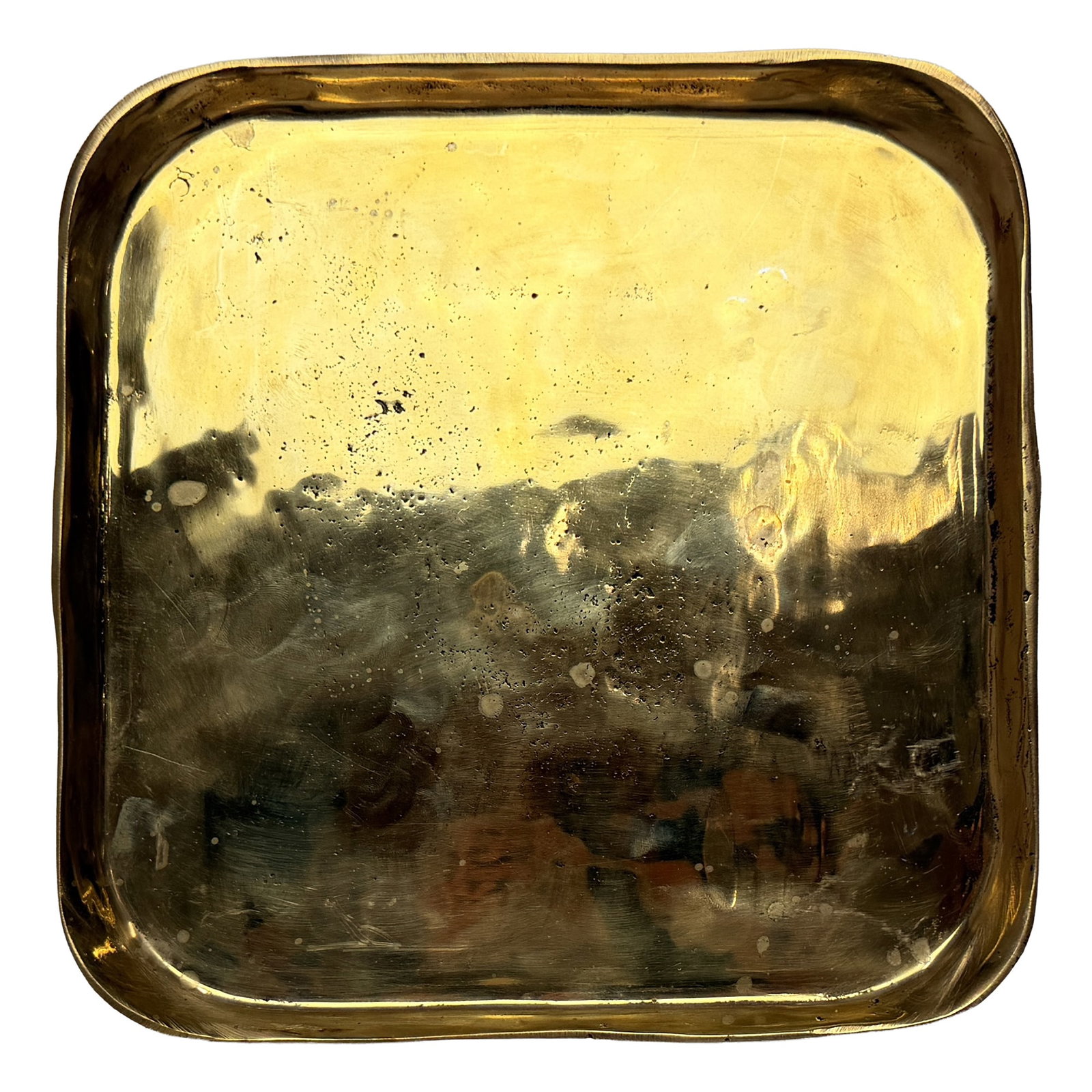 Square Brass Decorative Tray: Sculptural square decorative tray in a polished brass-tone finish, featuring softly rounded corners, a shallow profile, and an intentionally irregular reflective surface that gives the piece an