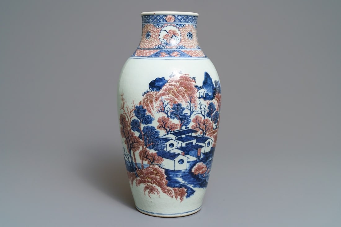 A Chinese blue, white and underglaze red landscape vase, 19th C. (1 of 7)