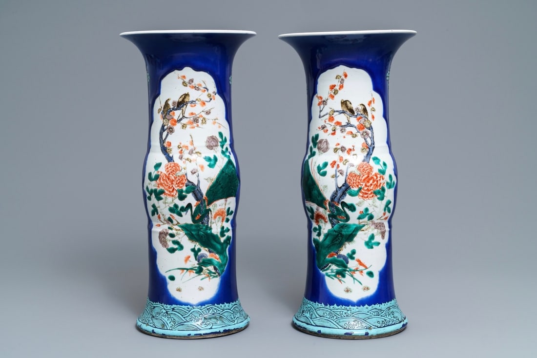 A pair of Chinese famille verte powder blue-ground gu vases, Kangxi mark, 19th C.: A pair of Chinese famille verte powder blue-ground gu vases, Kangxi mark, 19th C. ----- H.: 45,5 cm