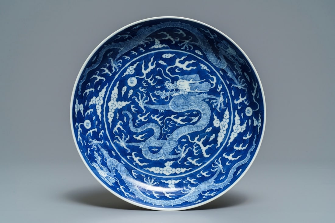 A Chinese blue and white reverse-decorated 'dragon' dish (1 of 2)