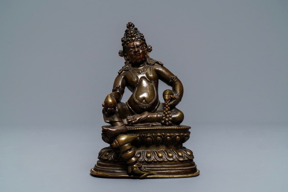 A Sino-Tibetan bronze figure of Jambhala, 17/18th C. (1 of 4)