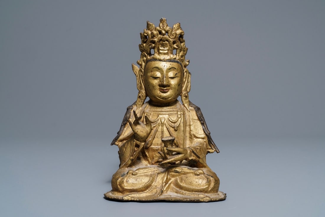 A Chinese gilt bronze figure of Buddha, Ming: A Chinese gilt bronze figure of Buddha, Ming ----- H.: 23,5 cm Provenance: The collection of Gerard Vissering, former president of the Dutch National Bank. He was an advisor to the Chinese emperor and