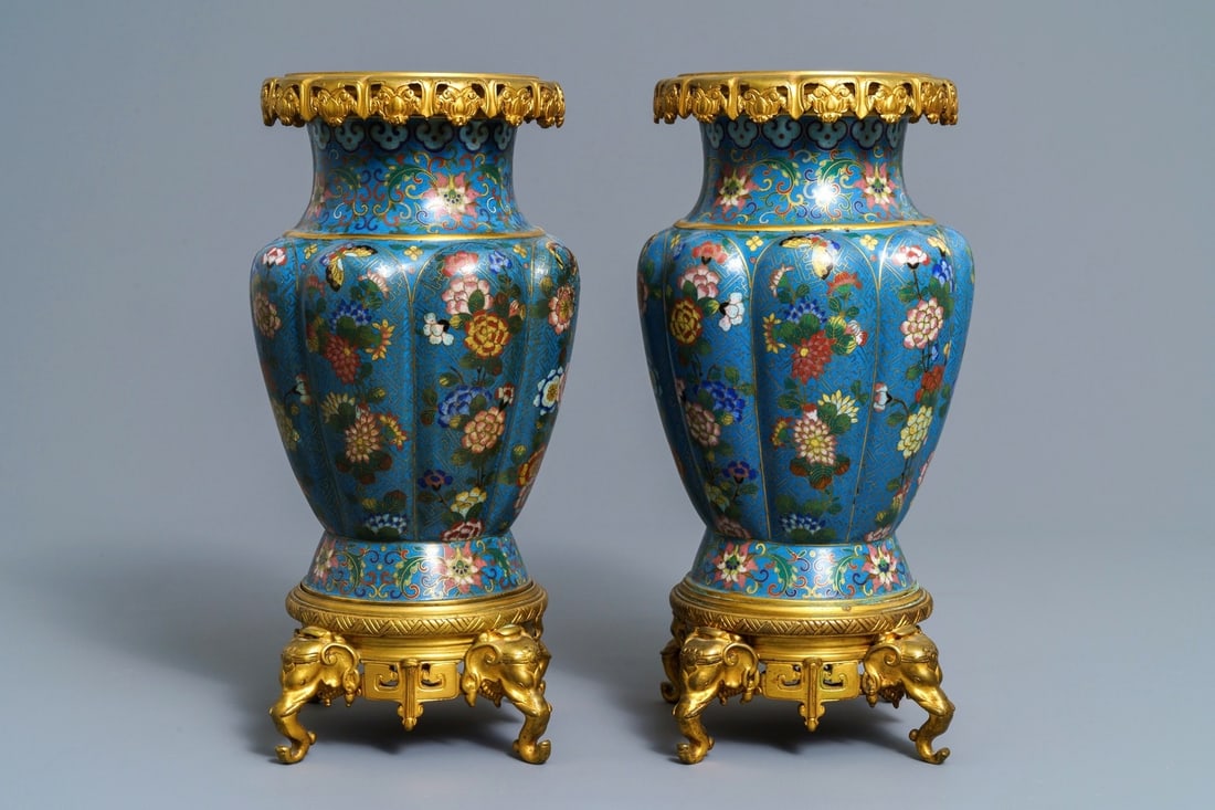 A pair of Chinese gilt bronze mounted cloisonné vases, 19th C.: A pair of Chinese gilt bronze mounted cloisonné vases, 19th C. ----- H.: 34,5 cm