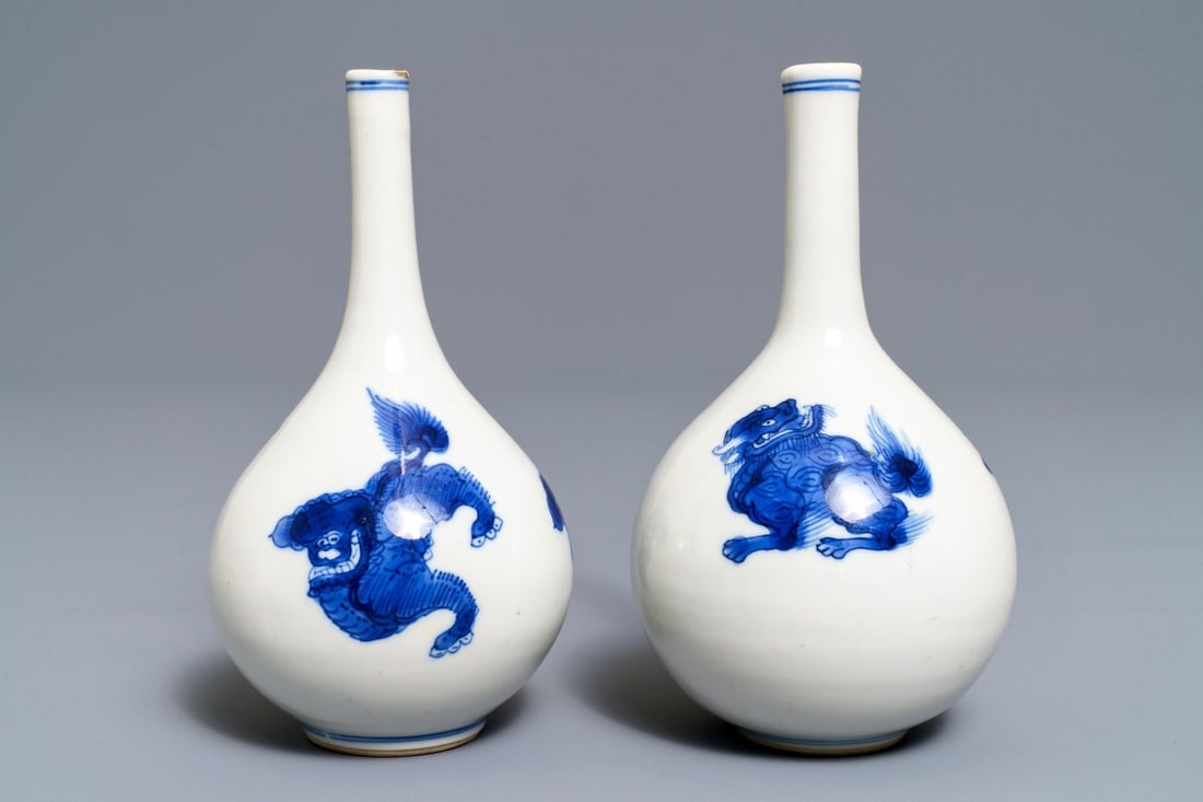 A pair of Chinese blue and white bottle vases with qilins: A pair of Chinese blue and white bottle vases with qilins, Kangxi ----- H.: 14 cm