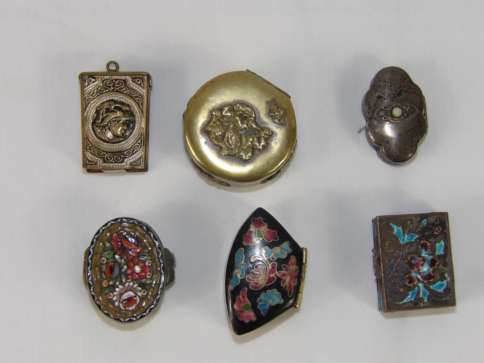 6 early pill boxes: 6 early pill boxes. All measurements approximate. Please see photos for condition and details. Selling as is from 04281.