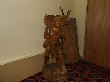 Hand carved Native American carrying deer figure