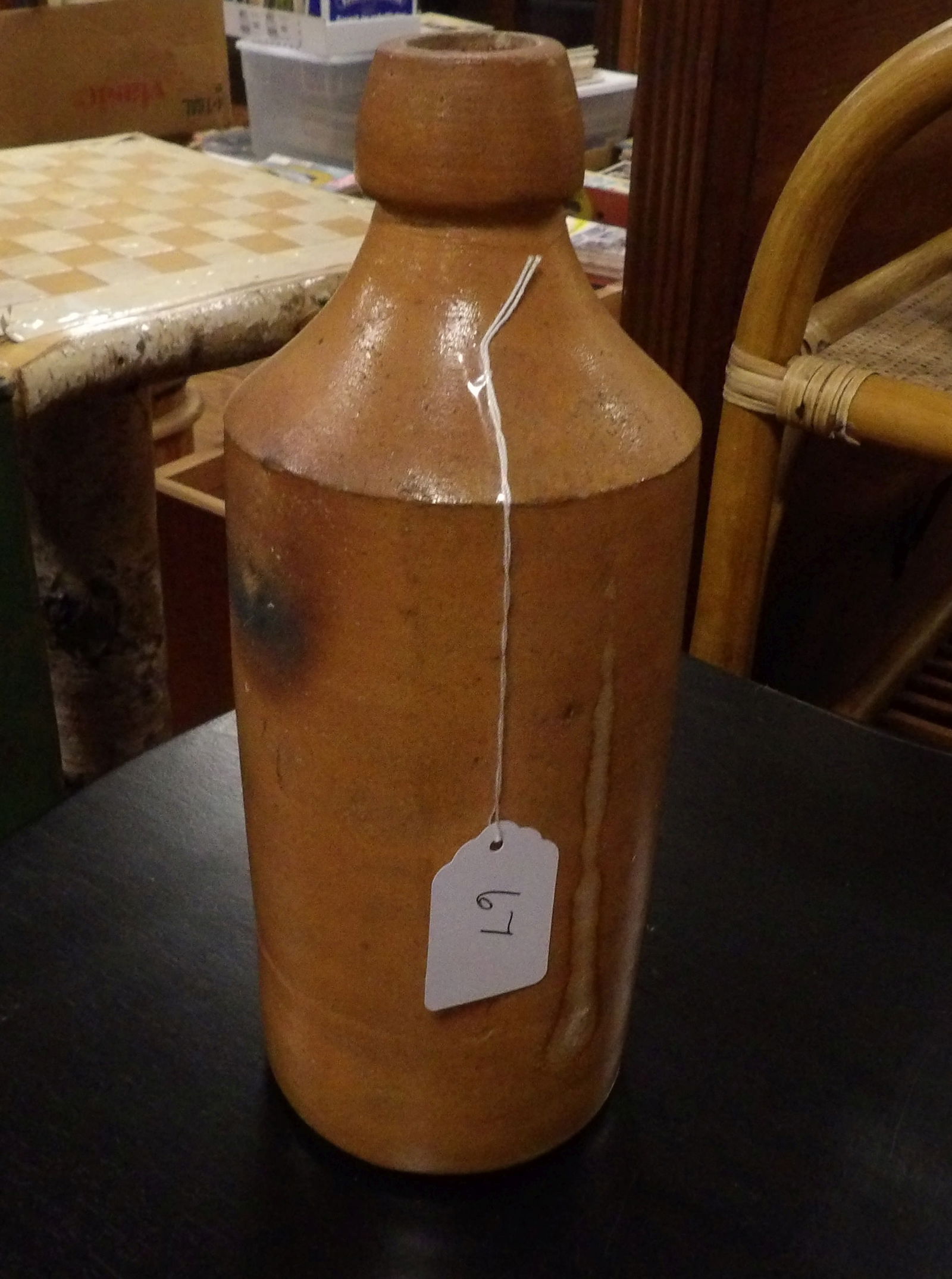 Clay bottle: Clay bottle. 9 1/2". All measurements approximate. Please see photos for condition and details. Selling as is from 04281.