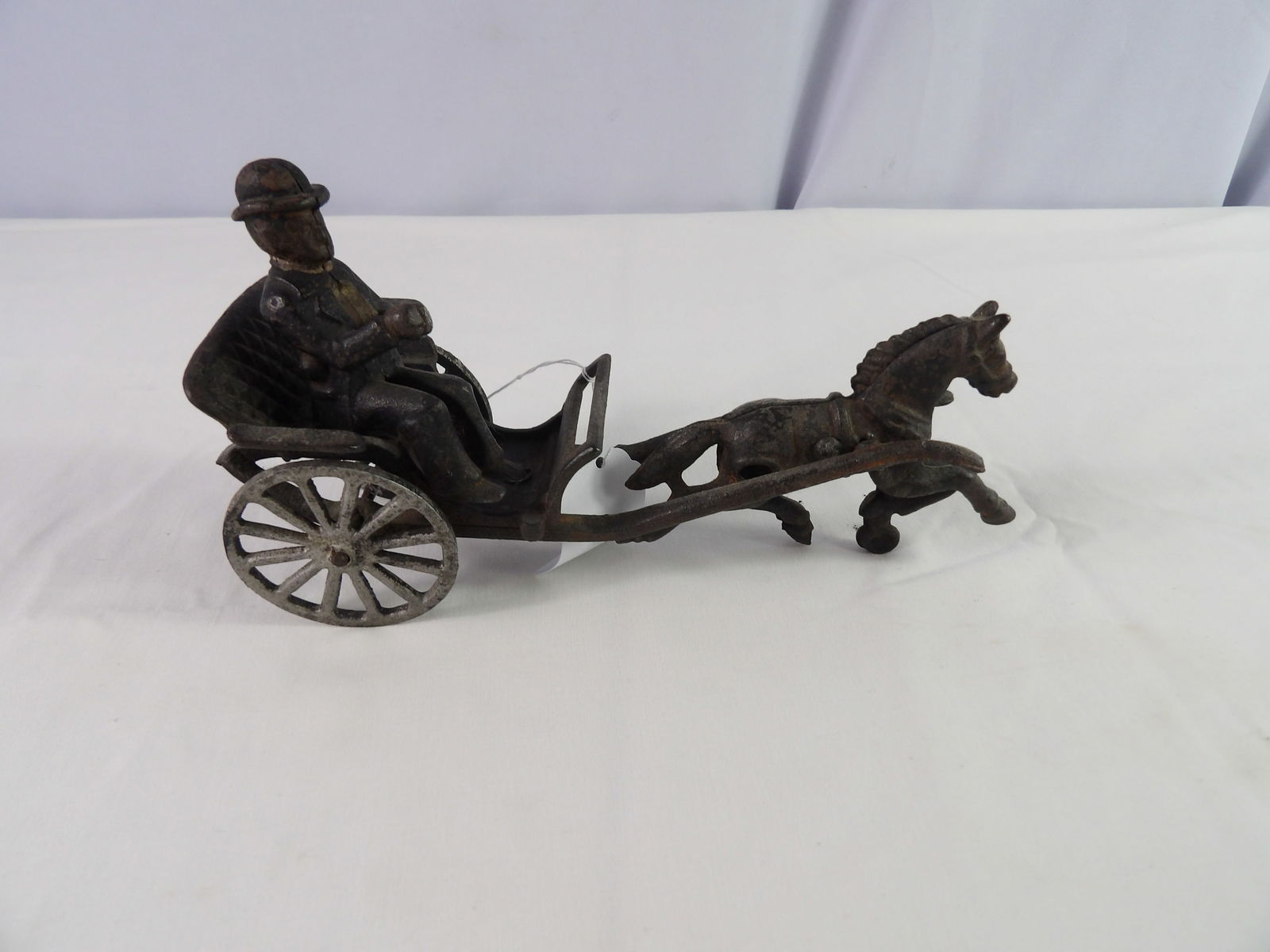 Cast Iron Horse and Buggy: 8" Cast Iron Horse and Buggy. All measurements approximate. Please see photos for condition and details. Selling as is from 04281.