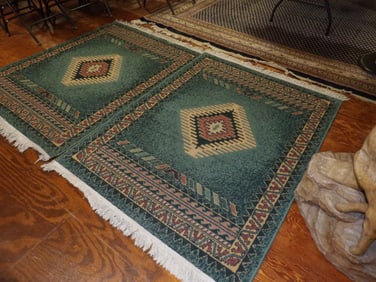 Two matched rugs with southwest design