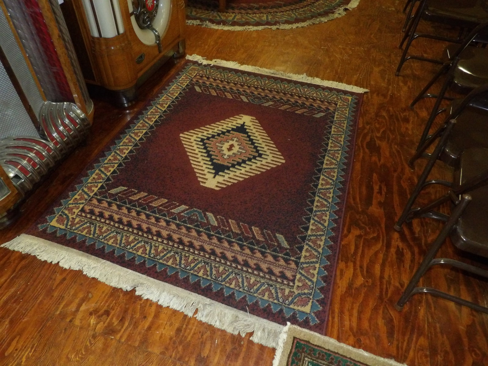 Woven rug with southwest design: Woven rug with southwest design. 47" by 67". All measurements approximate. Please see photos for condition and details. Selling as is from 04281.