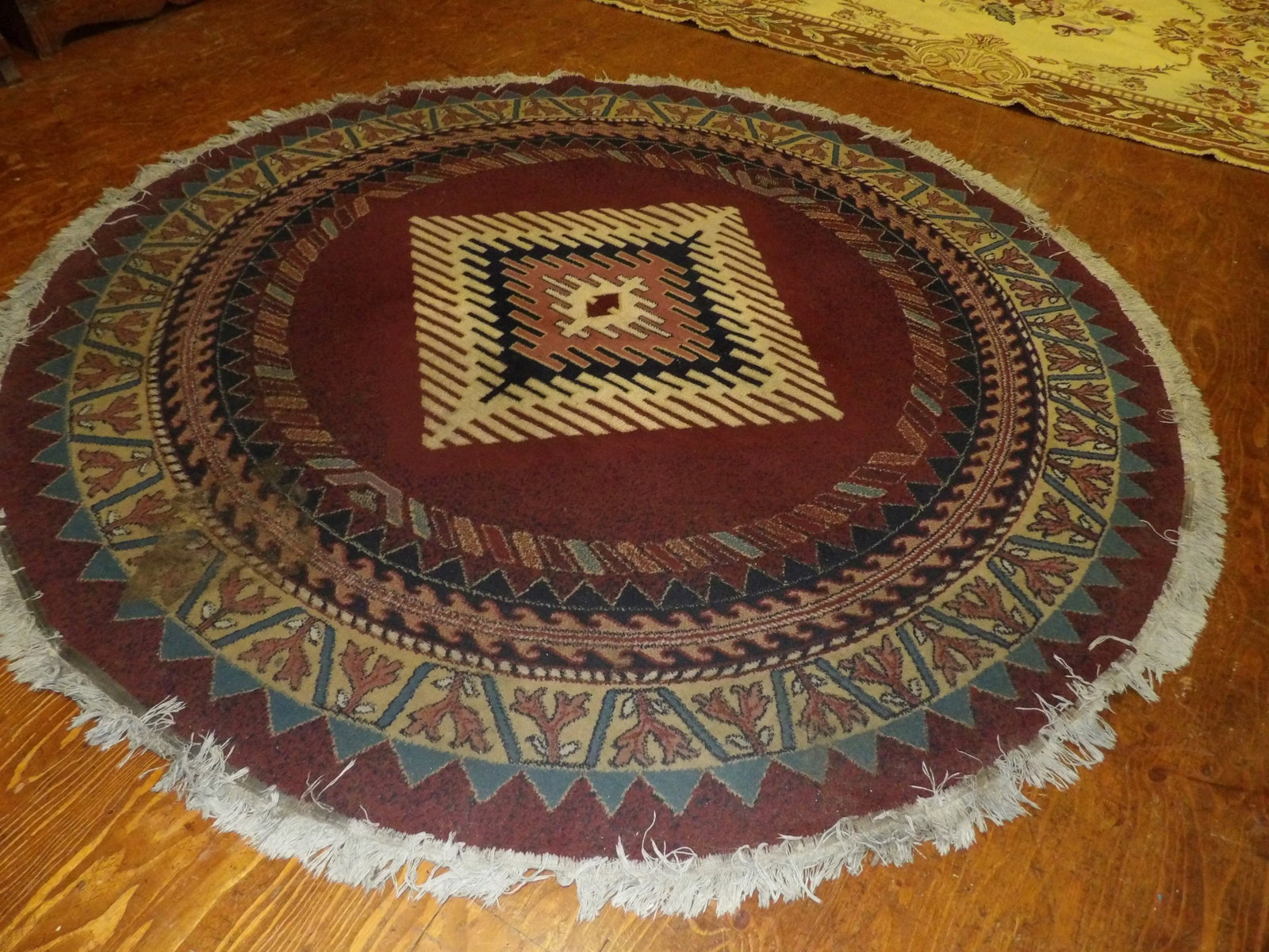 Round woven rug with southwest design: Round woven rug with southwest design. 8' diameter. All measurements approximate. Please see photos for condition and details. Selling as is from 04281.
