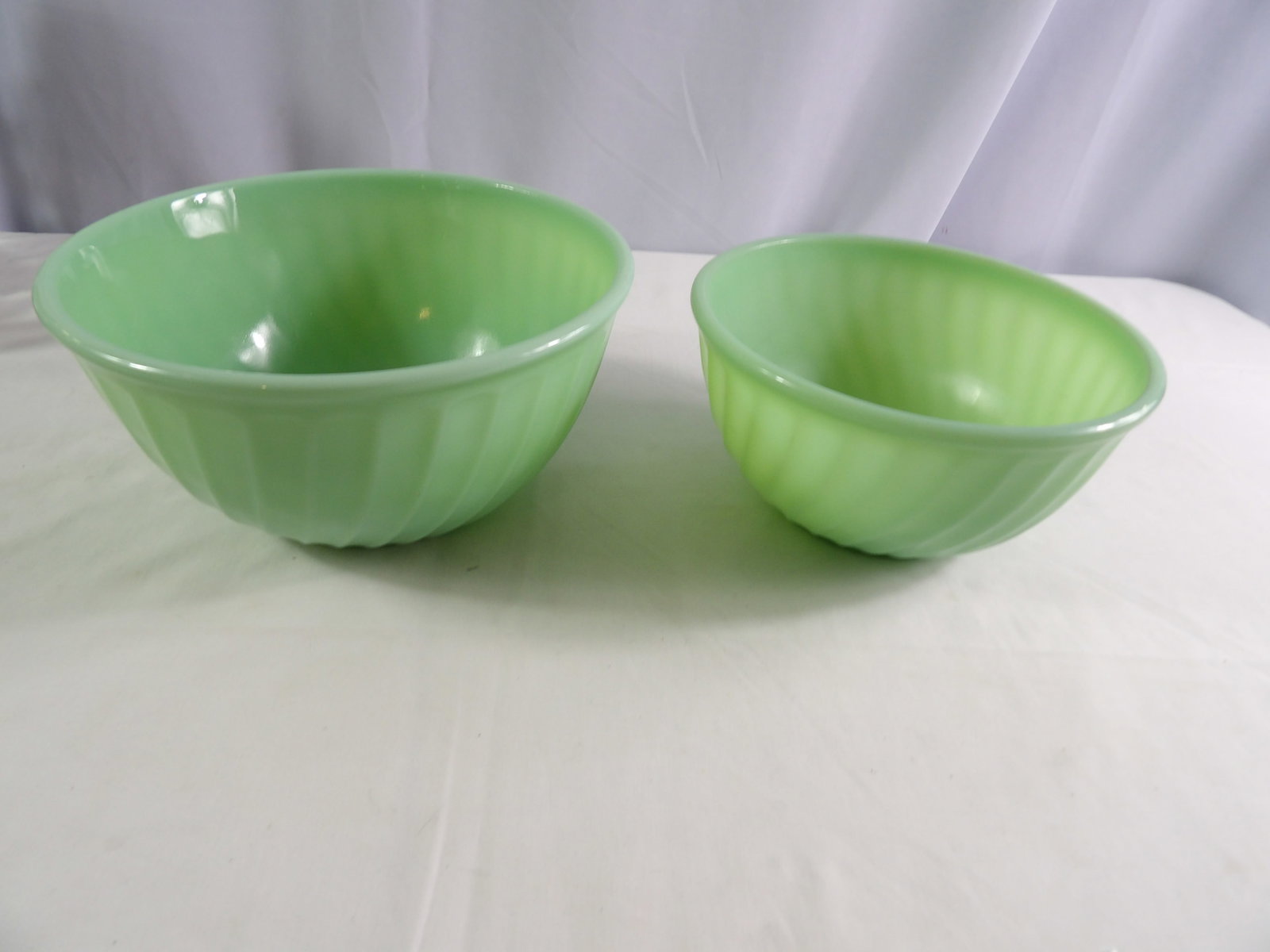 Pair Fire King Bowls: Pair of Green Fire King Bowls. Great Condition. All measurements approximate. See photos for condition and details. Selling as is from 04281.