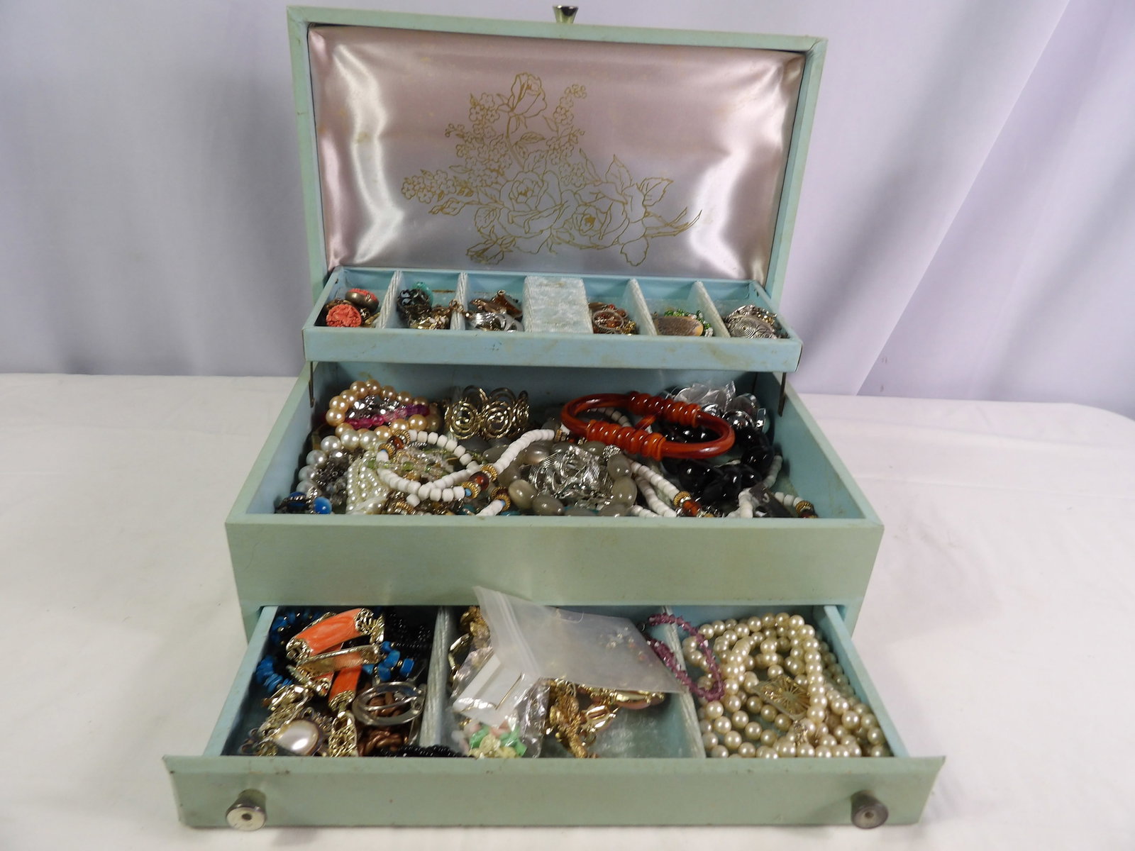 Large Lot of Costume Jewelry: Large Lot of Costume Jewelry with Box. All measurements approximate. See photos for condition and details. Selling as is from 04281.
