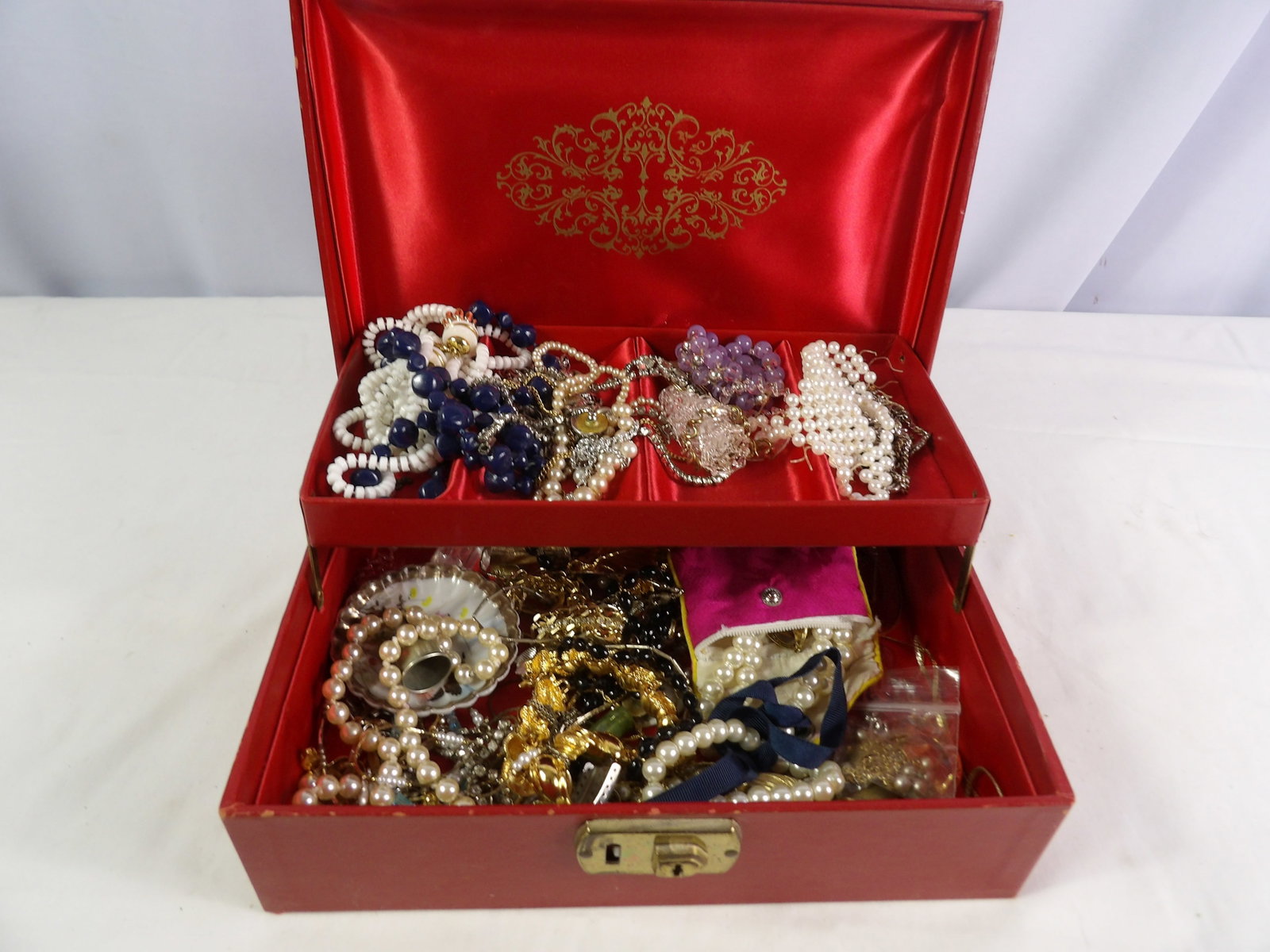 Large Lot of Costume Jewelry: Large Lot of Costume Jewelry with Box. All measurements approximate. See photos for condition and details. Selling as is from 04281.