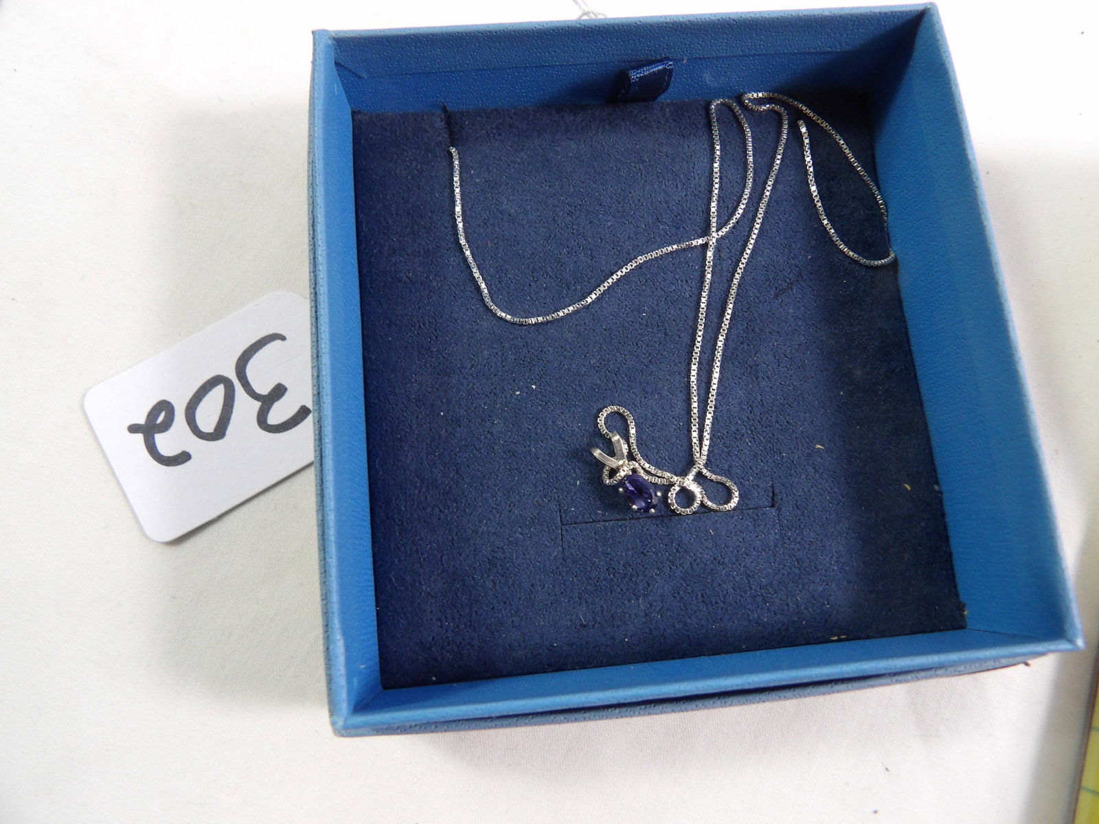 Iolate Necklace: Iolate Necklace, 1.5 ctw. 18" Sterling Silver Chain. All Measurements approximate. See photos for condition and details. Selling as is from 04281.
