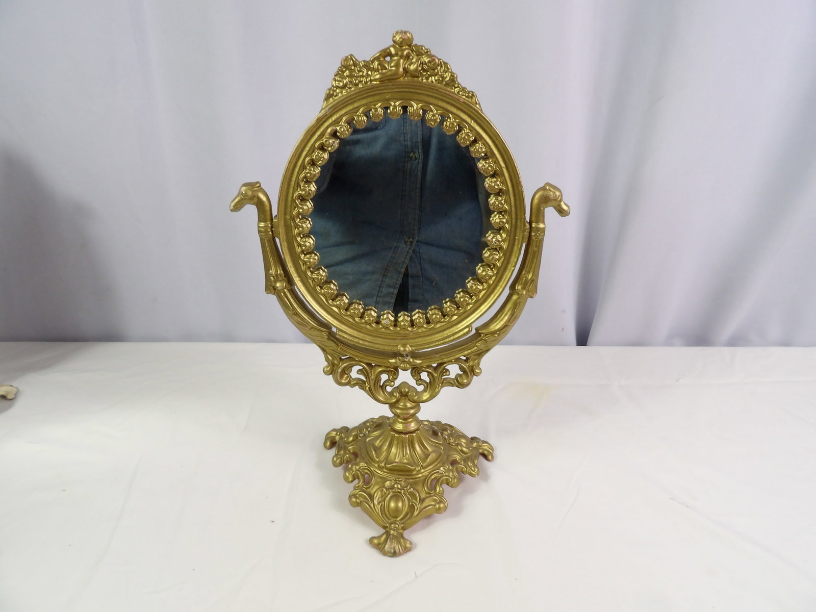 Vintage Boudoir Mirror: 15" Tall x 10" Wide Vintage Cast Iron Boudoir Mirror, Gold . All measurements approximate. Please see photos for condition and details. Selling as is from 04281.