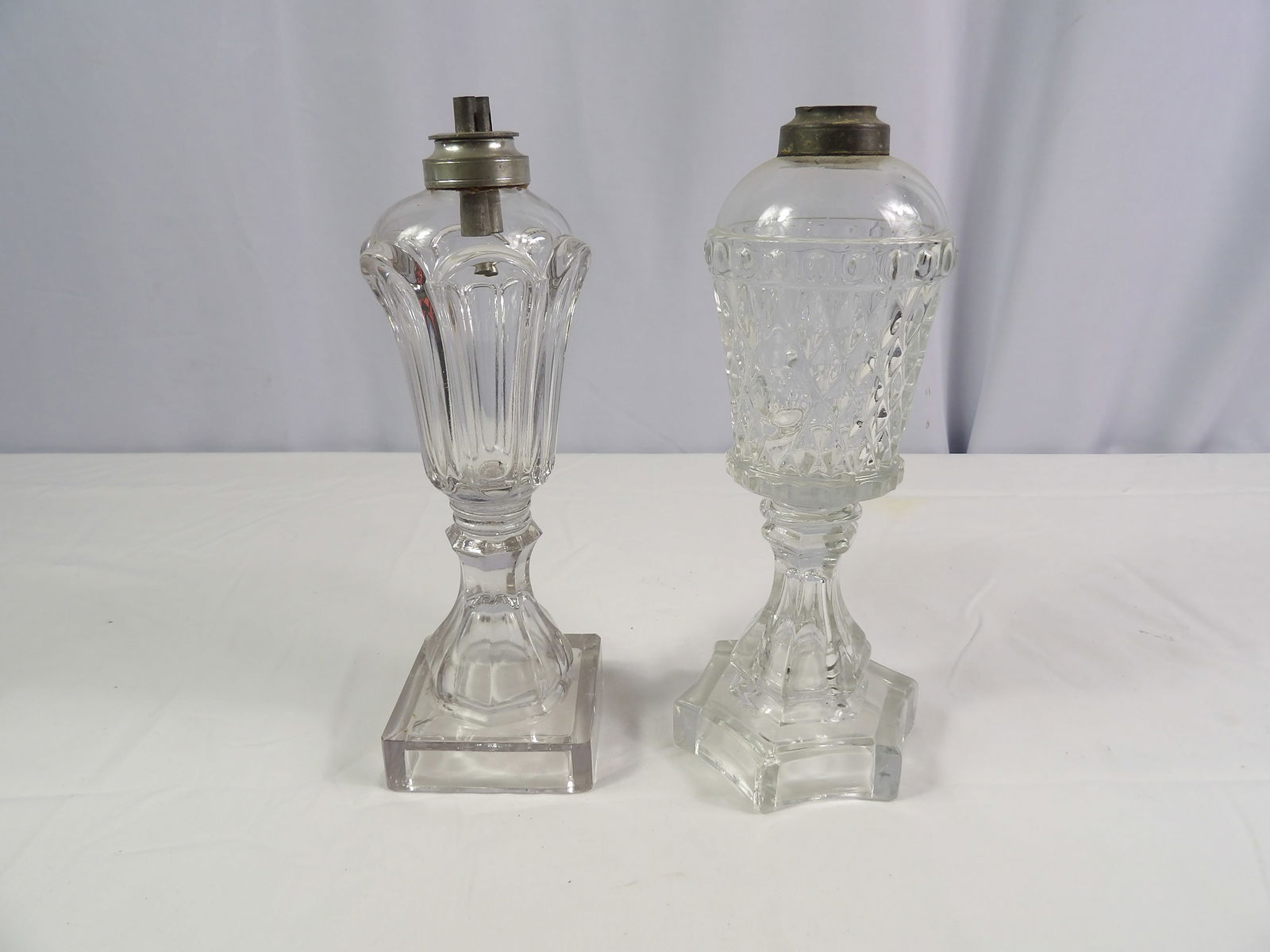 Pair Whale Oil Lamps: Pair 9 1/2" Whale Oil Lamps. All measurements approximate. Please see photos for condition and details. Selling as is from 04281.