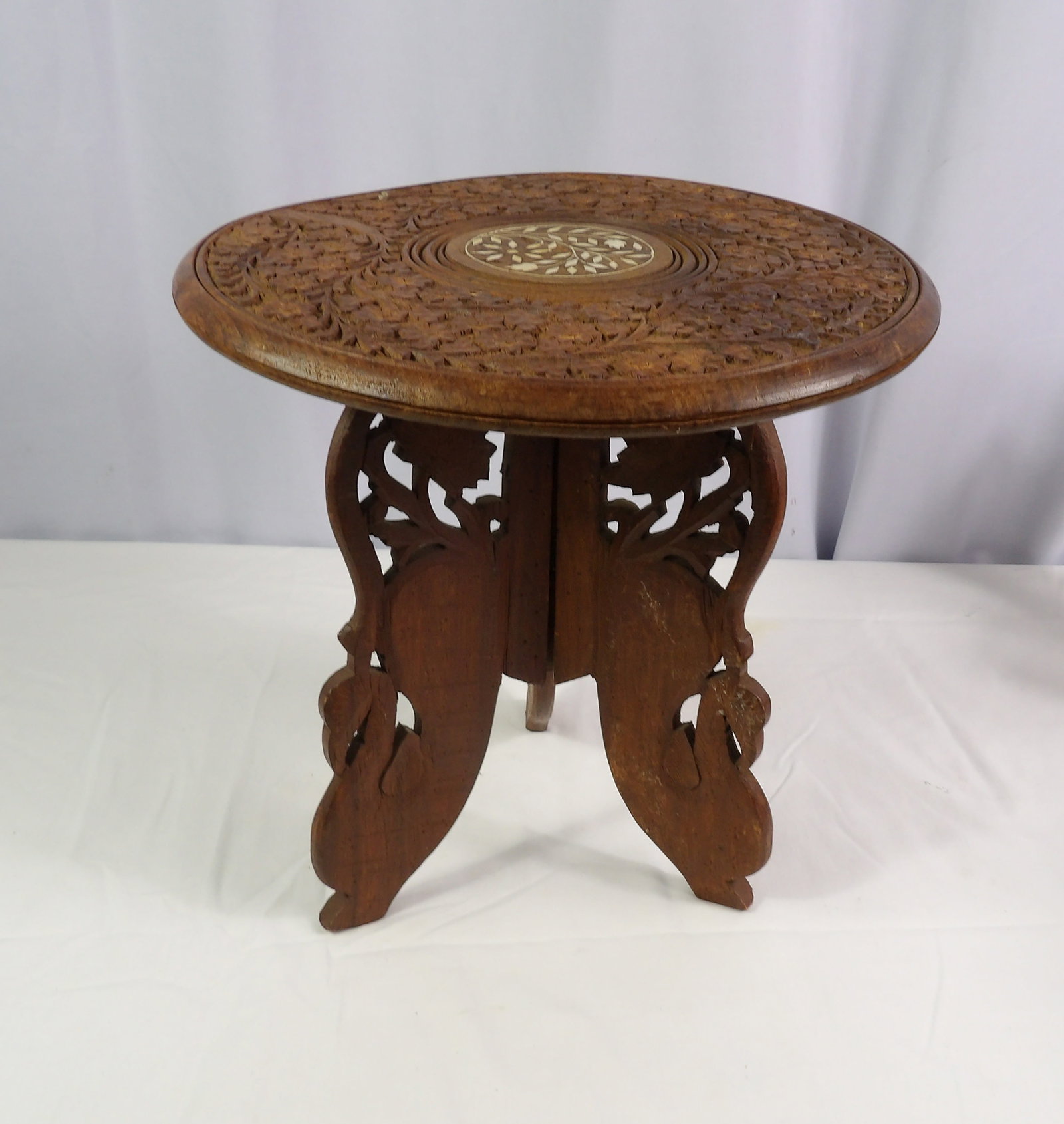 Teakwood Stand: 12" Tall x 12" Diameter Teakwood Stand. All measurements approximate. Please see photos for condition and details. Selling as is from 04281.