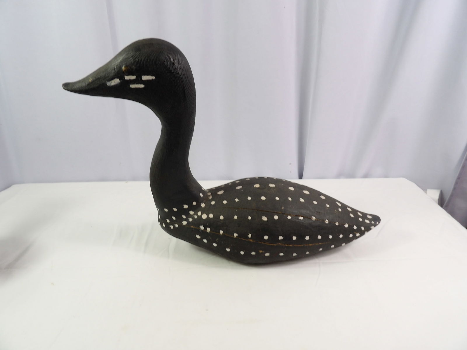 24" Long Wooden Loon: 24" Long Wooden Loon. All measurements approximate. Please see photos for condition and details. Selling as is from 04281.