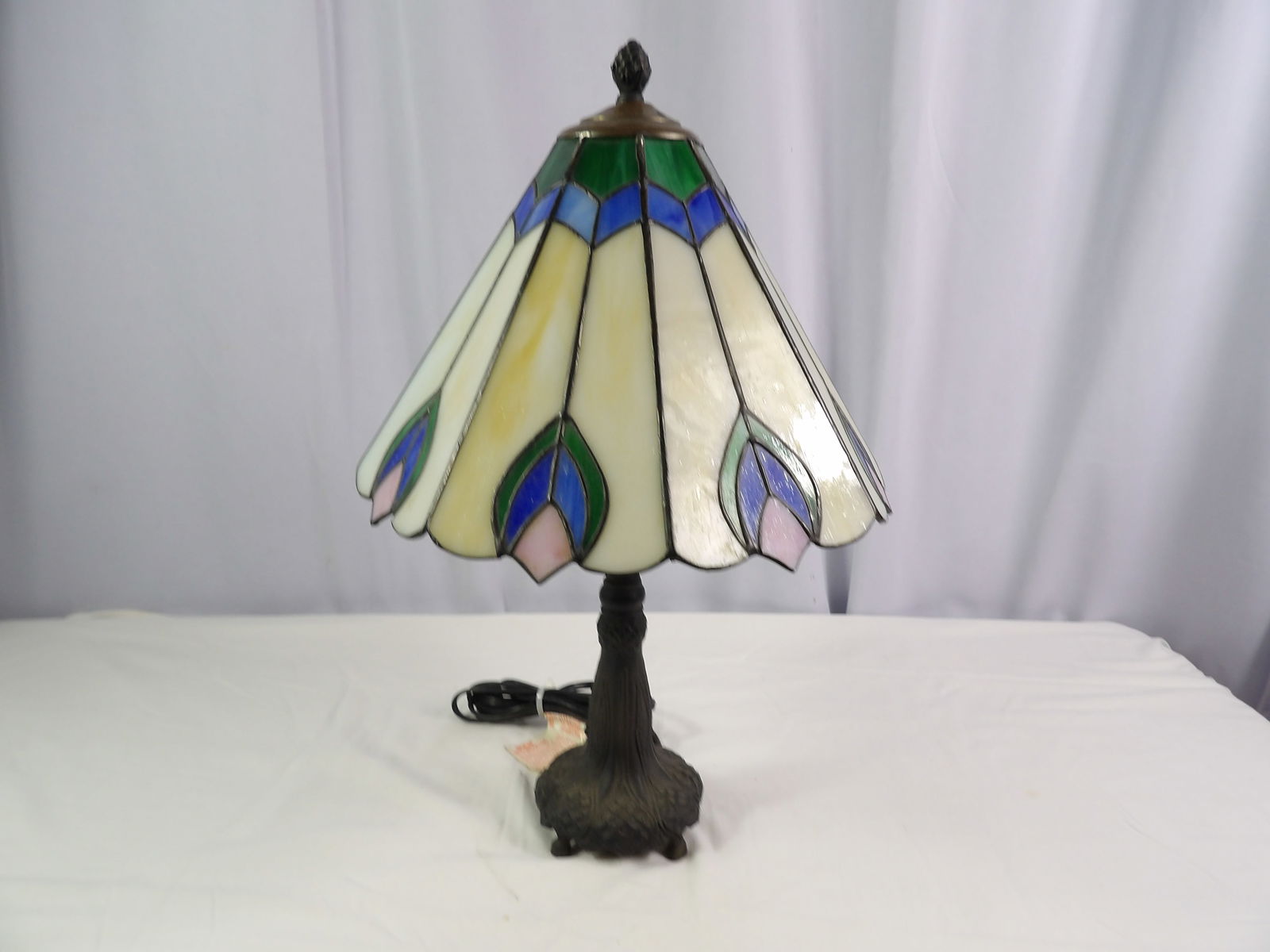 Leaded Slag Glass Lamp with Cast Iron Base: Leaded Slag Glass Lamp with Cast Iron Base. 23" Tall x 12" Diameter. All measurements approximate. Please see photos for condition and details. Selling as is from 04281.