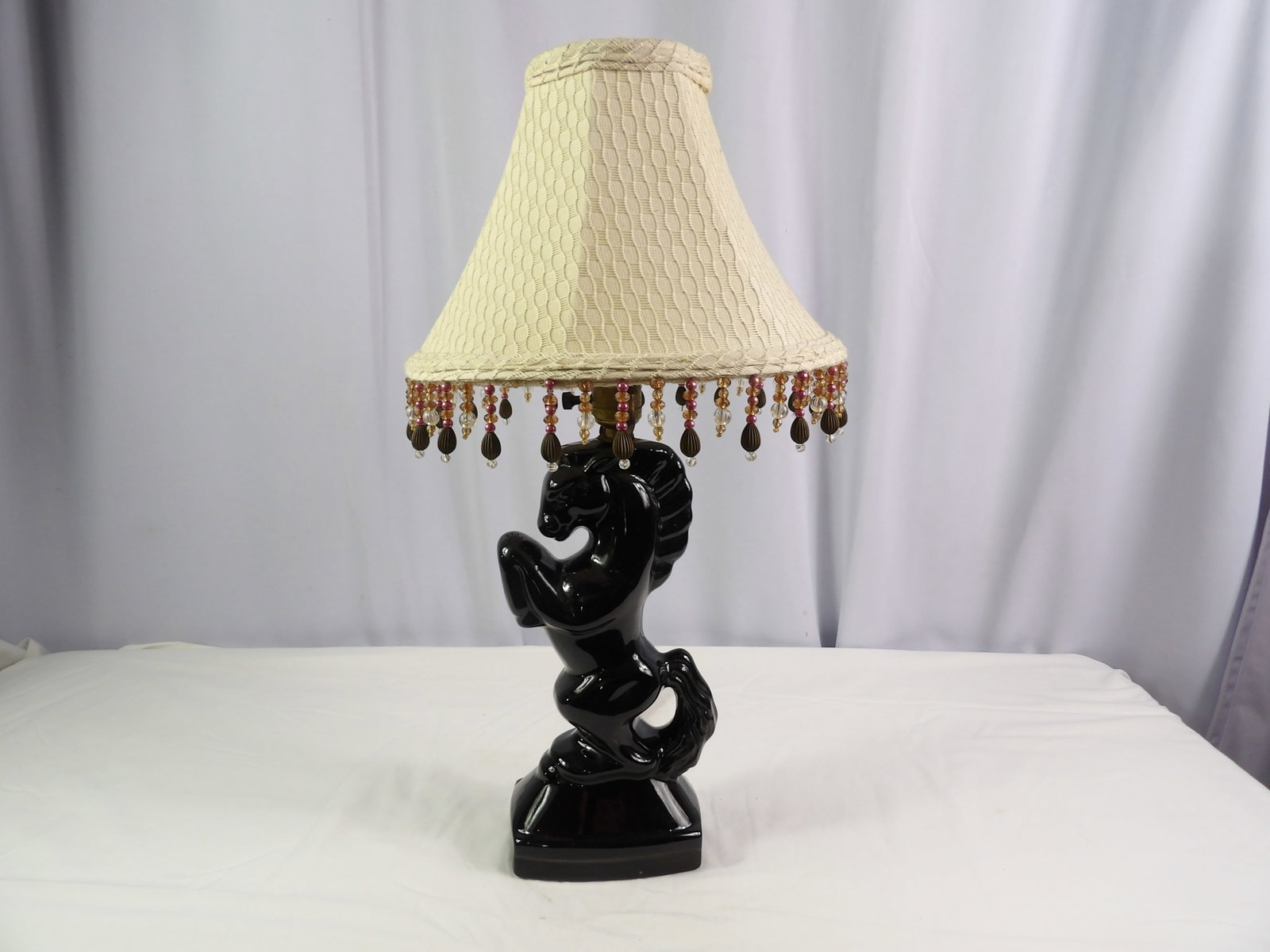 Black Glass Stallion Lamp: Black Glass Stallion Lamp. 22" Tall All measurements approximate. Please see photos for condition and details. Selling as is from 04281.