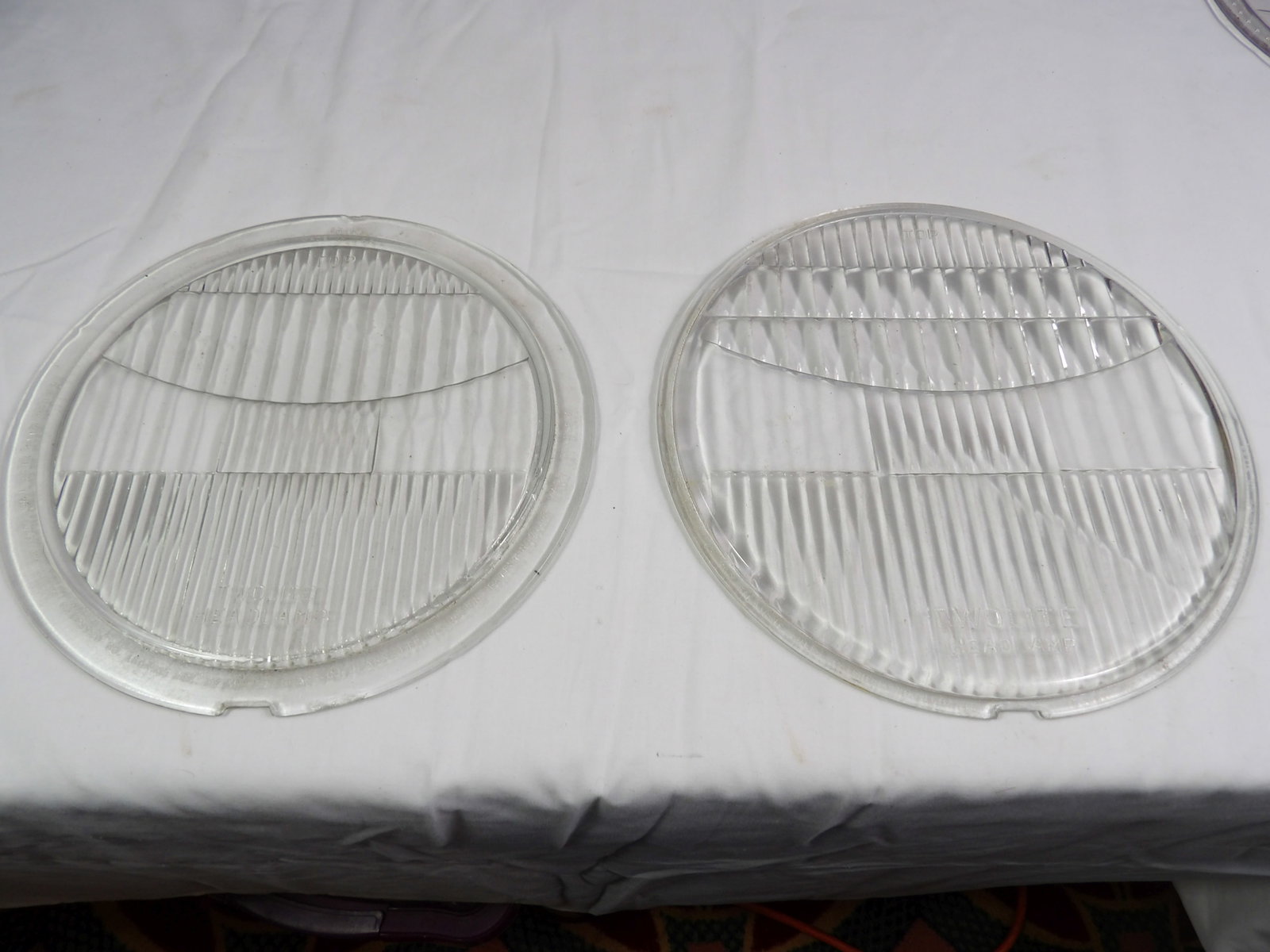 Pair TwoLite Car Headlamp Lenses.: Pair TwoLite Car Headlamp Lenses. 1) 9x 7 23/32, 1) 9 7/16 x 8 31/32. All measurements approximate. Please see photos for condition and details. Selling as is from 04281.