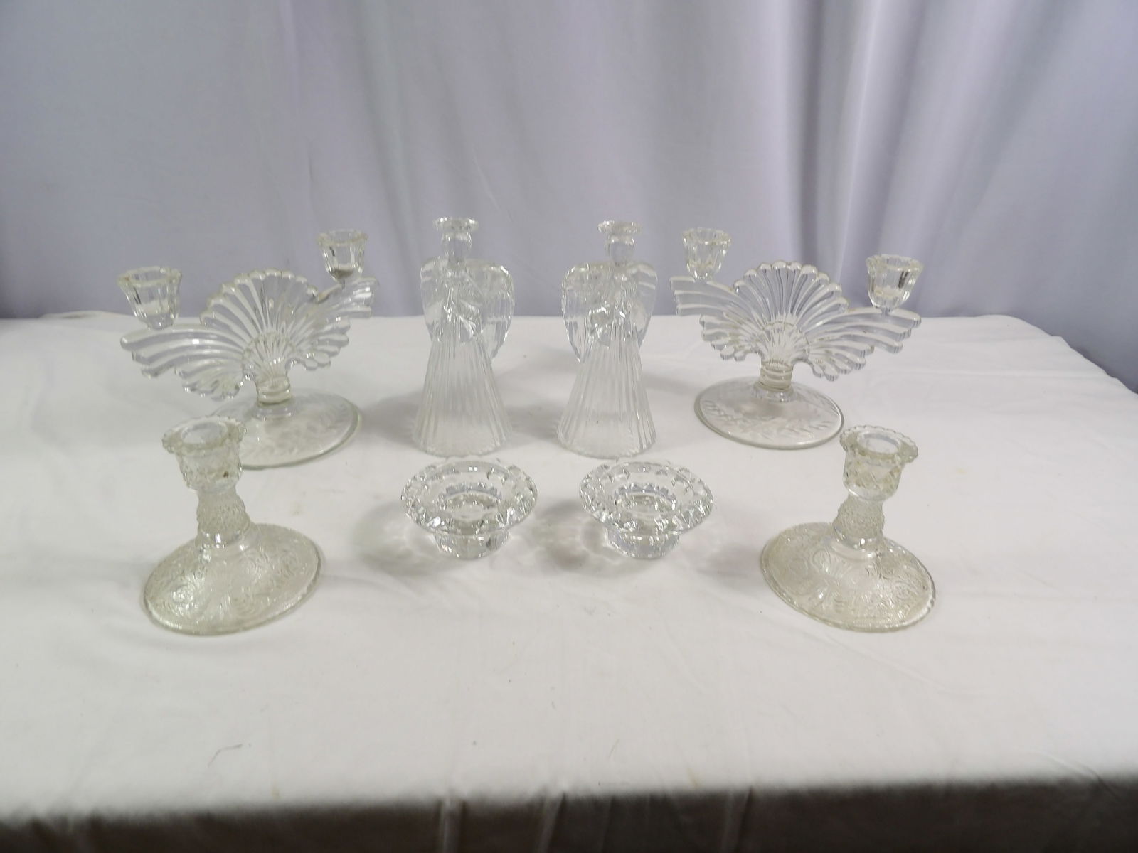 4 Sets-Crystal Candle Sticks: 4 Sets of Crystal Candle Sticks. All measurements approximate. Please see photos for condition and details. Selling as is from 04281.