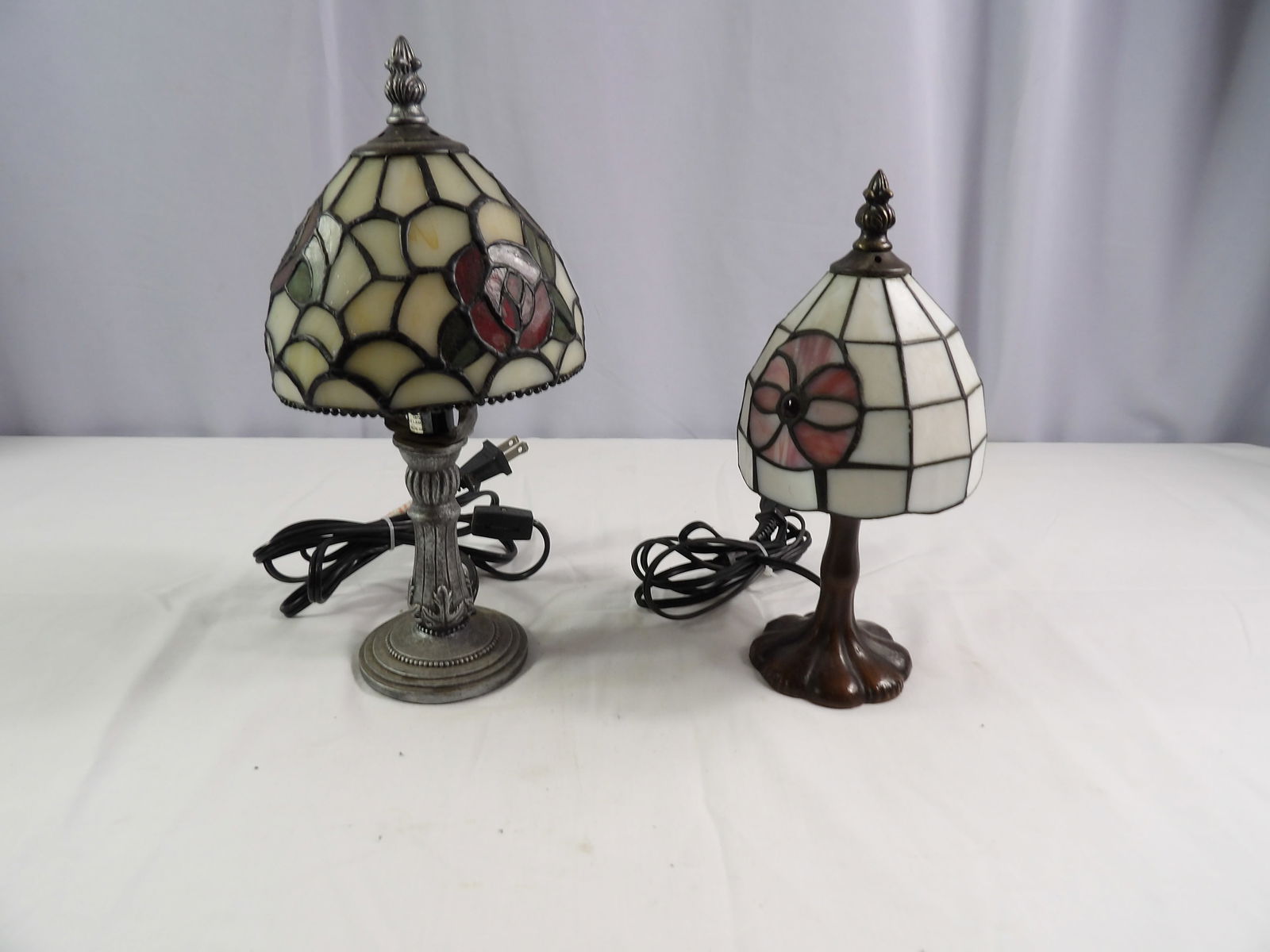 Pair of Stained Glass Lamps: Pair of 10" Stained Glass Lamps. All measurements approximate. Please see photos for condition and details. Selling as is from 04281.