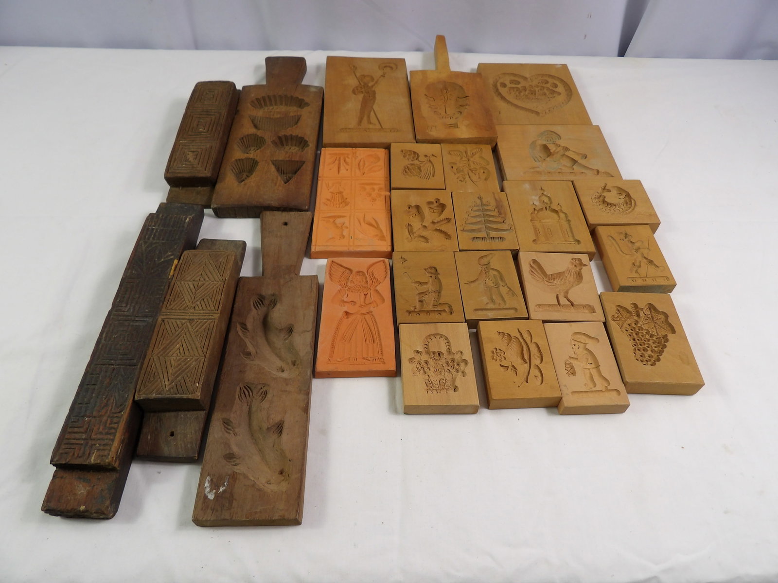 German Butter Molds: Large Lot of German Butter Molds. All measurements approximate. Please see photos for condition and details. Selling as is from 04281.