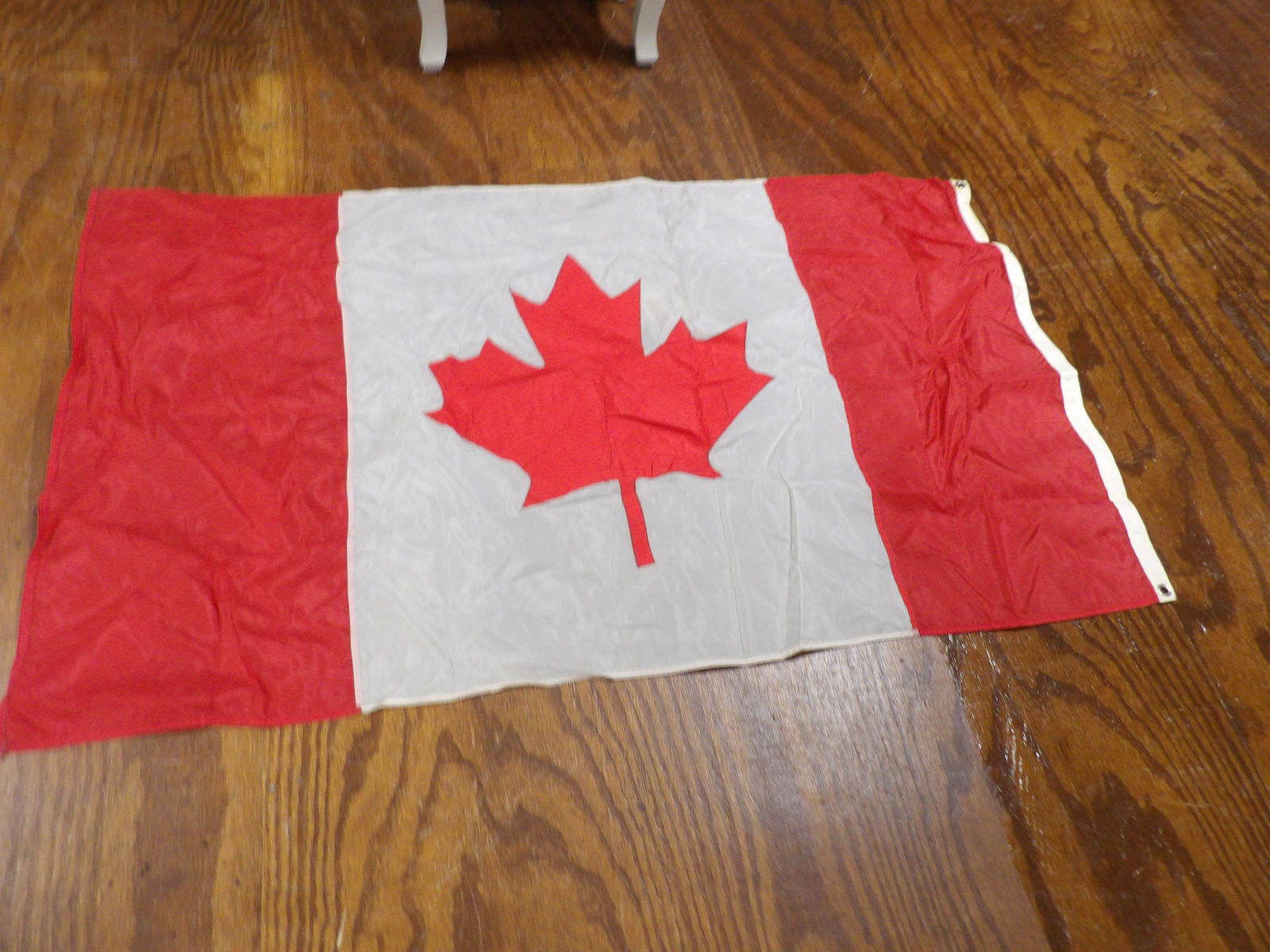 Canadian Flag: Canadian Maple Leaf Flag. 3' x 4'. All measurements approximate. Please see photos for condition and details. Selling as is from 04281.