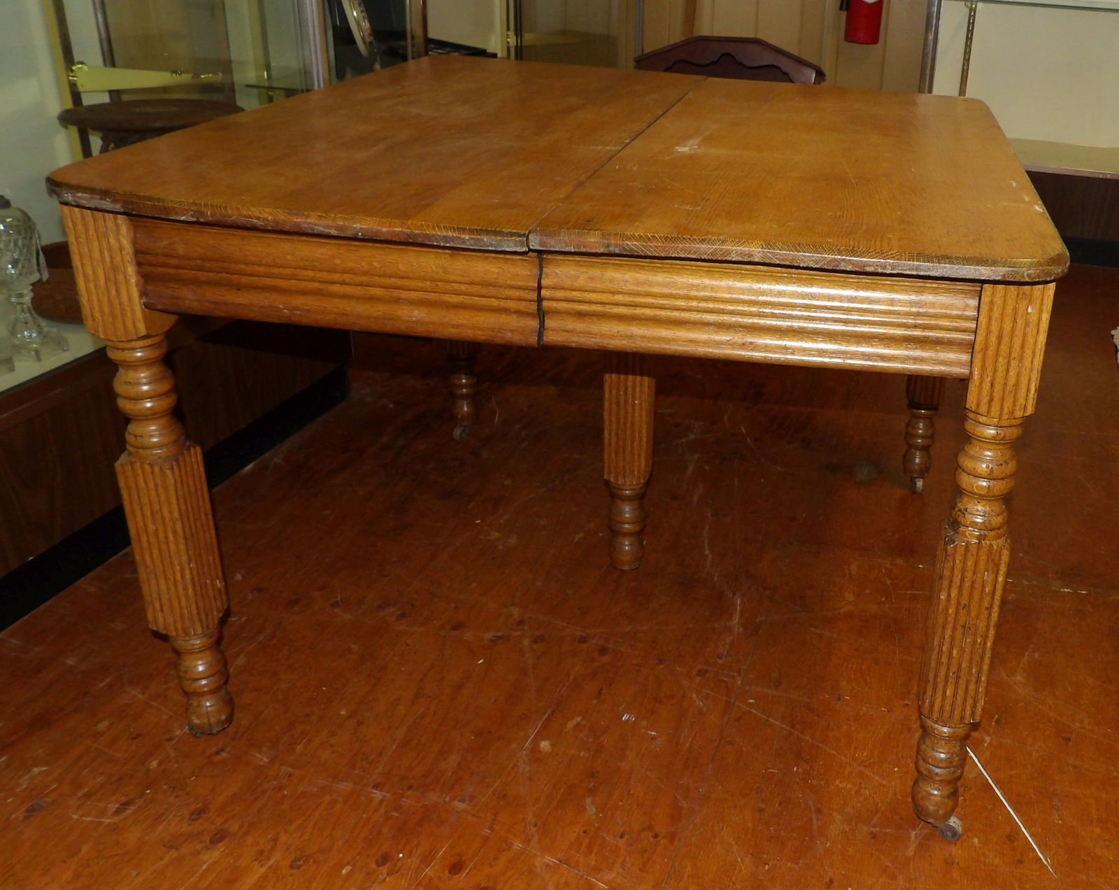 Oak Table with 4 Leaves: Oak Table with 4 Leaves. 40" by 42". All measurements approximate. Please see photos for condition and details. Selling as is from 04281.