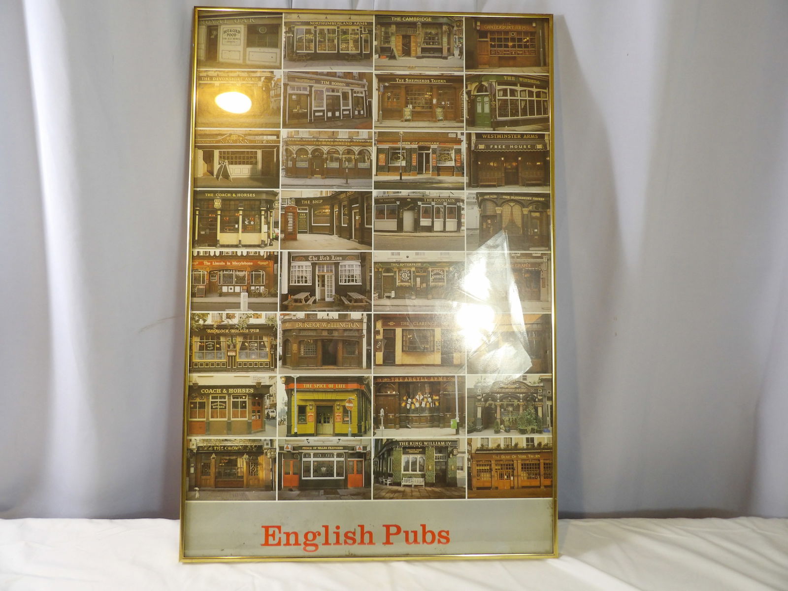 Framed Picture of English Pubs: Framed Picture of English Pubs. 22" x 33". All measurements approximate. Please see photos for condition and details. Selling as is from 04281.