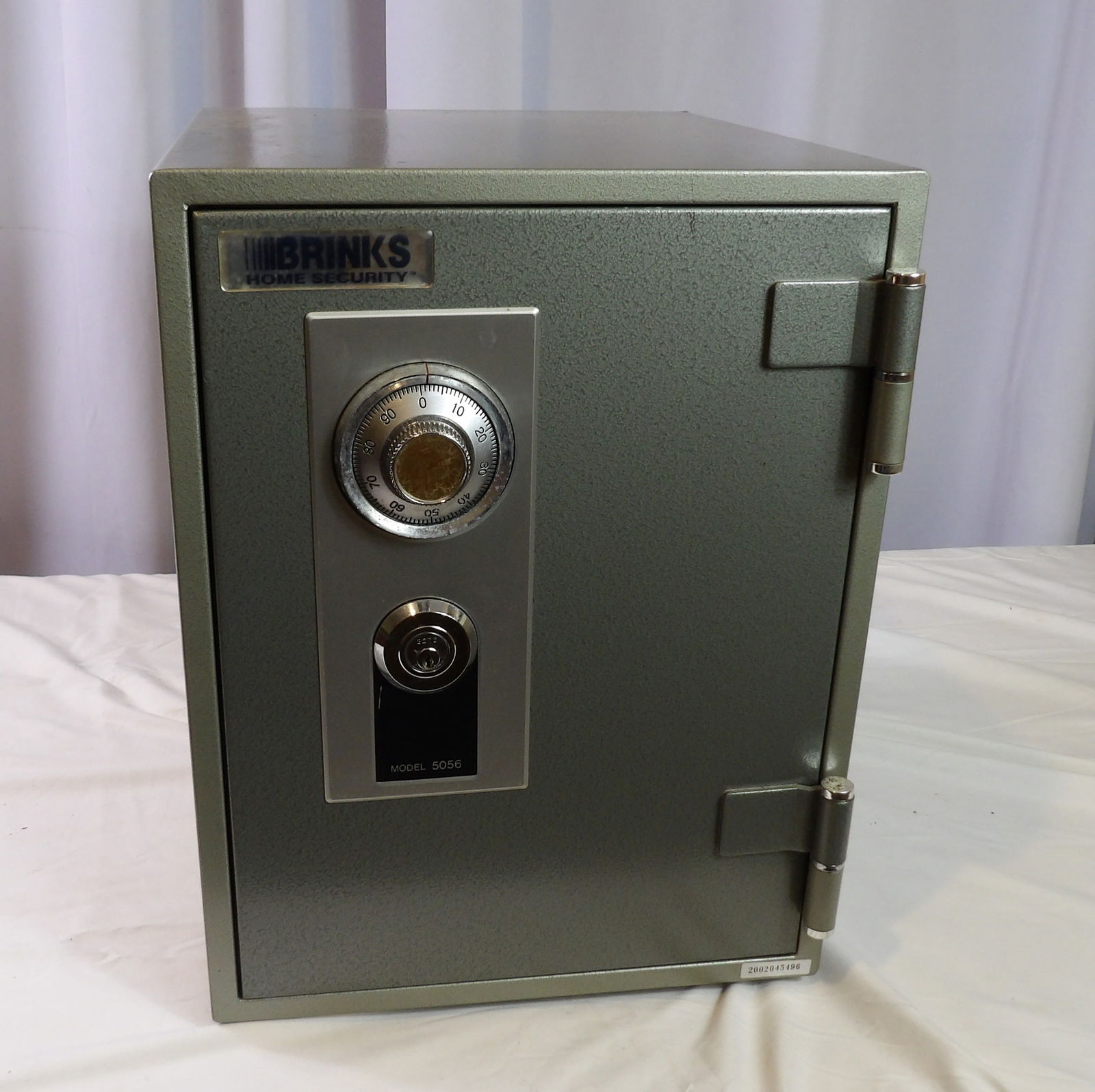 Brinks Home Security Safe: Brinks Home Security Safe. Model 5056. Key with Combination. All measurements approximate. Please see photos for condition and details. Selling as is from 04281.