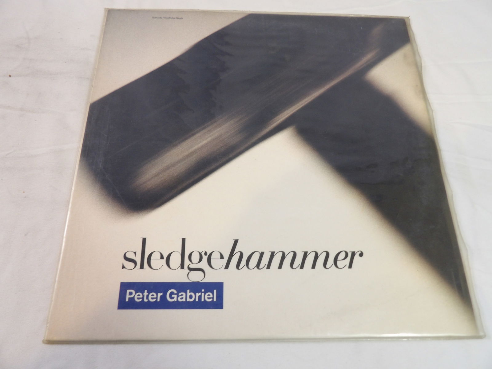 Peter Gabriel "Sledgehammer" LP: Peter Gabriel "Sledgehammer" LP. VG+. All measurements approximate. Please see photos for condition and details. Selling as is from 04281.