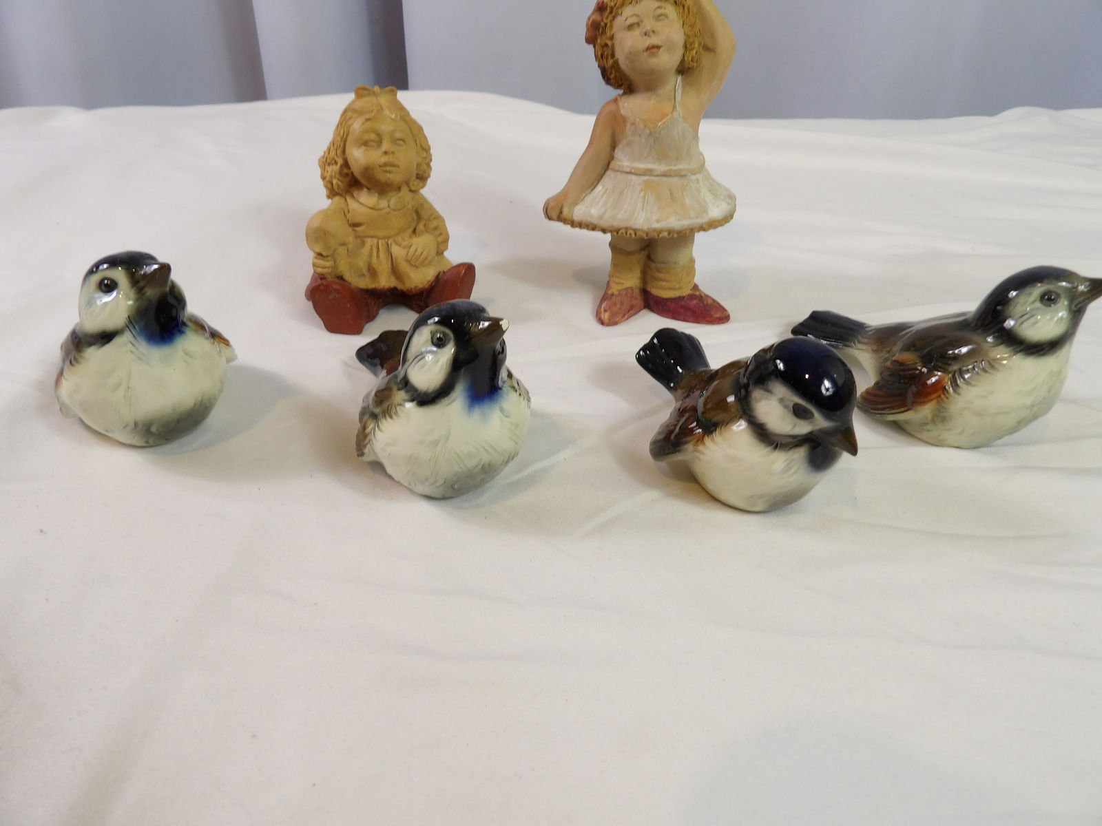 4 PCS-Porcelain Figurines: 4 Pieces Goebel Porcelain Birds and 2 Child Figurines. All measurements approximate. Please see photos for condition and details. Selling as is from 04281.