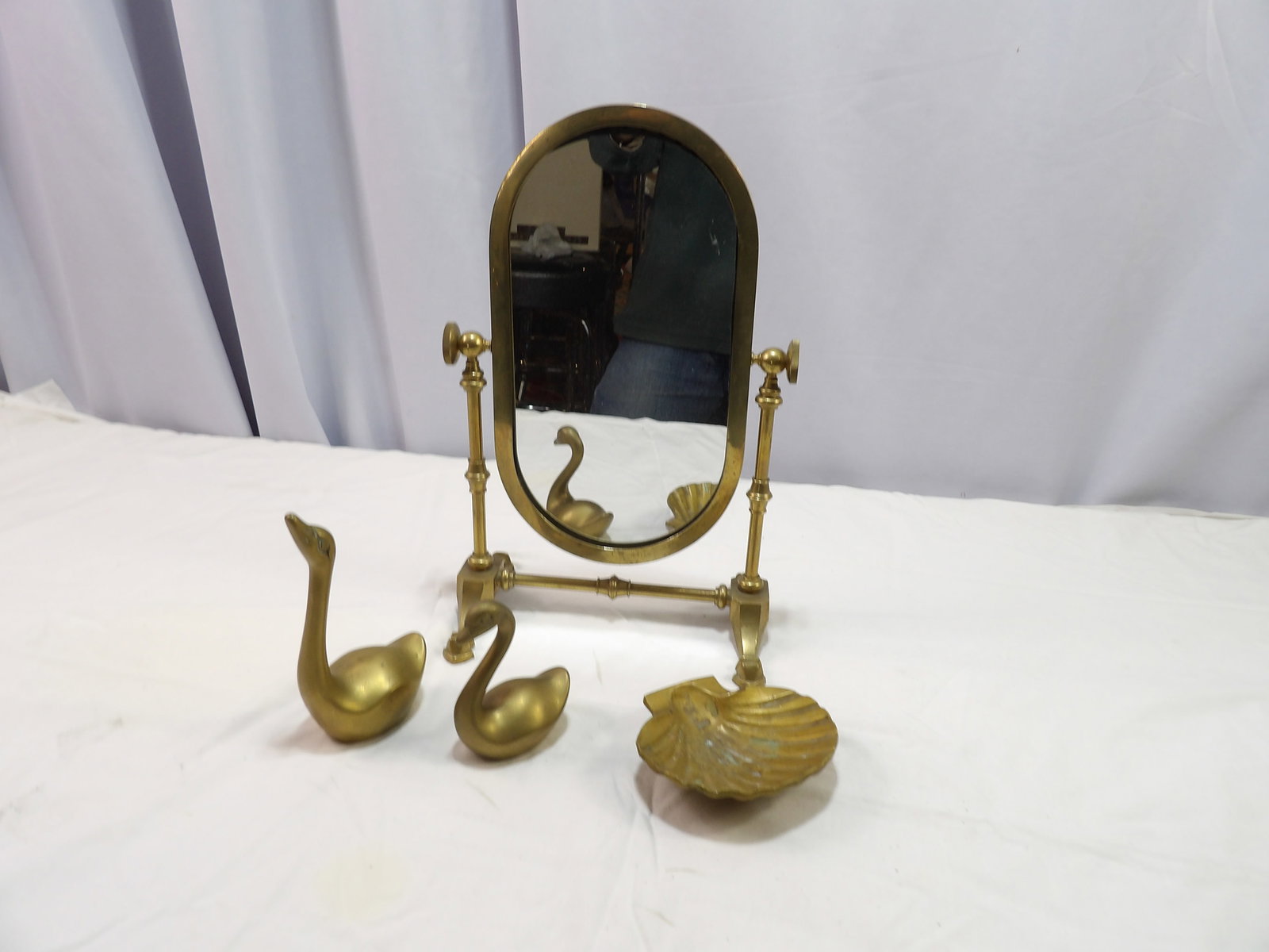 4 PCS-Brass Lot: 4 Pieces Brass Lot, 1 Table Mirror, 2 Swans, and 1 Shell. All measurements approximate. Please see photos for condition and details. Selling as is from 04281.
