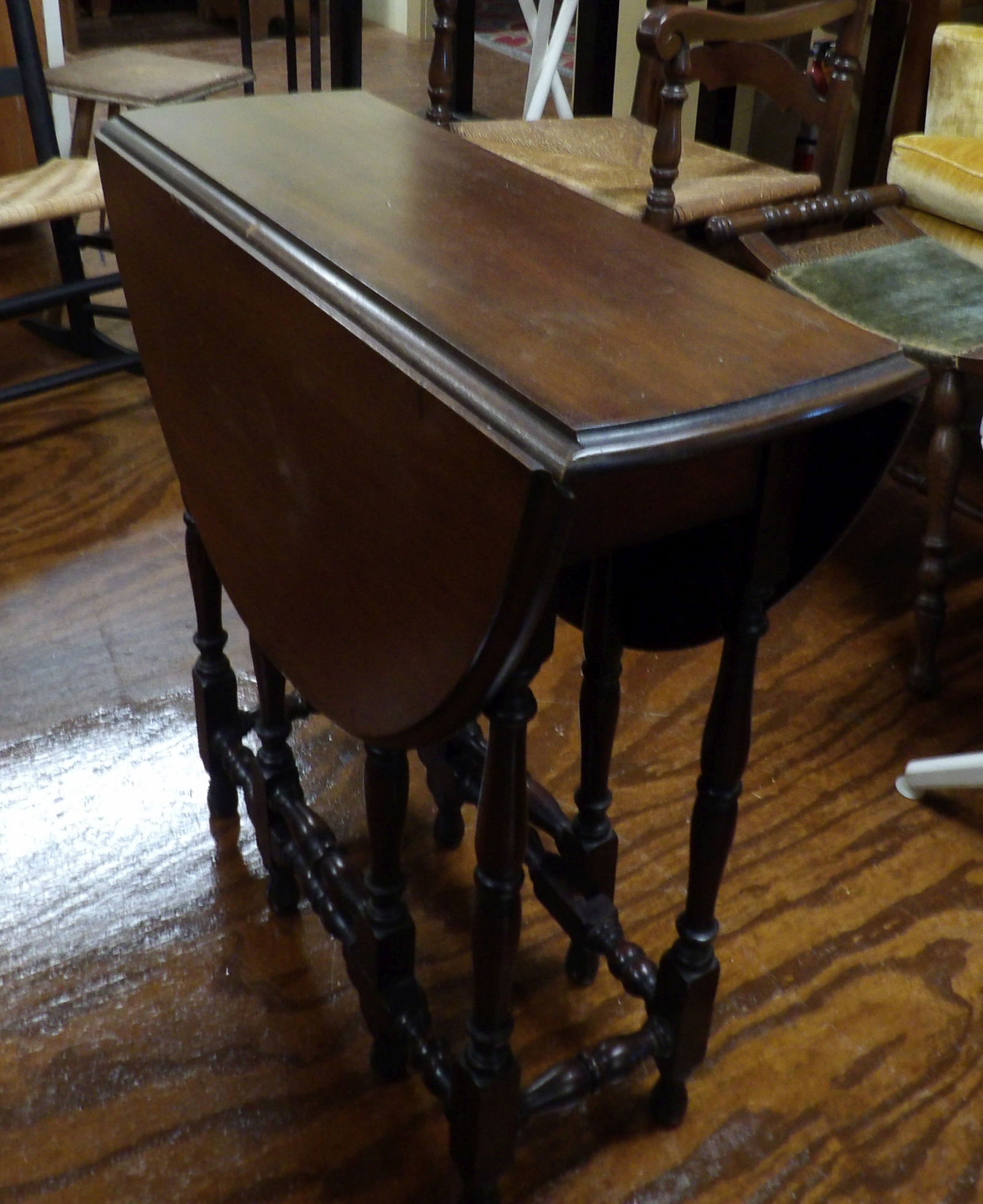 Gate Leg Table: Beautiful 28" Wide Gate Leg Table. All measurements approximate. Please see photos for condition and details. Selling as is from 04281.