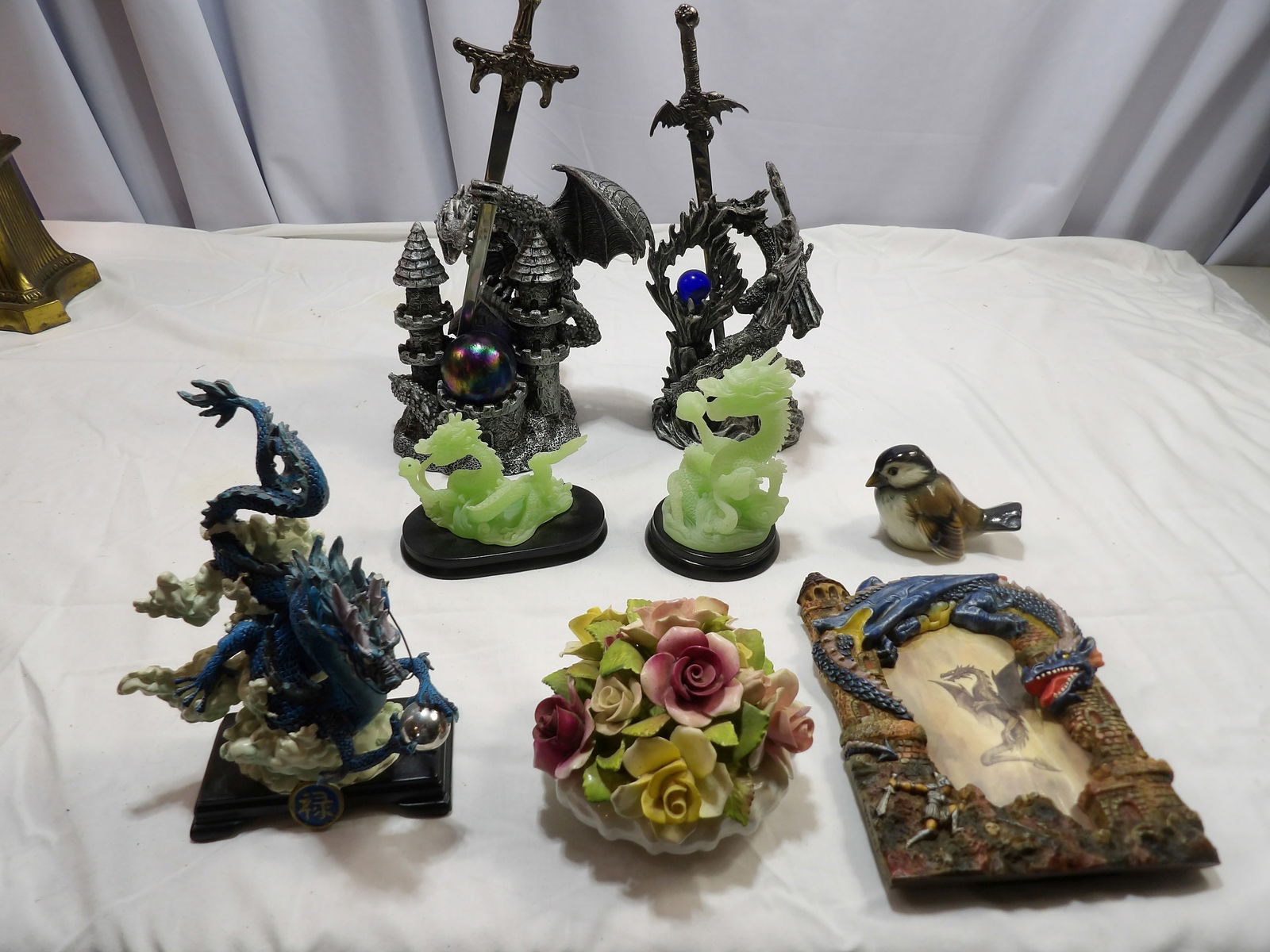 8 PCS-Assorted Figurines: 8 Assorted Figurines. All measurements are approximate. Please see photos for condition and details. Selling as is from 04281.