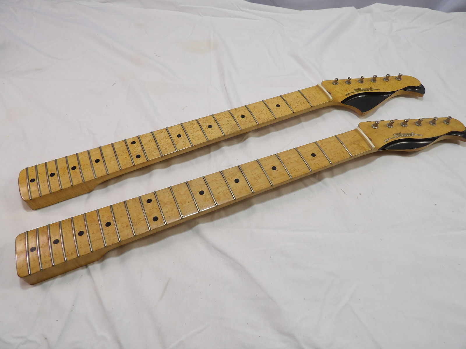 2 Stuart Guitar Necks: 2 New Birds Eye Maple, Stuart Guitar Necks. Perfect Condition. All measurements are approximate. Please see photos for condition and details. Selling as is from 04281.