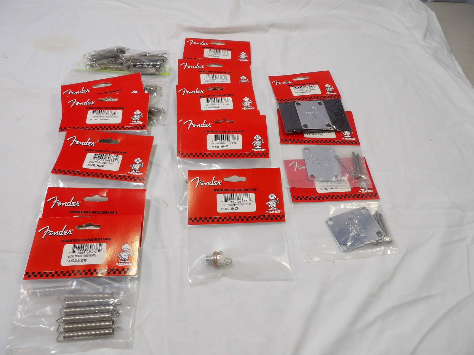 Miscellaneous Fender Parts Lot: New and Used Fender Parts, Neck Plates, Jack Phone Open Circuit, Spring Tremolo Tensions. All measurements are approximate. Please see photos for condition and details. Selling as is from 04281.