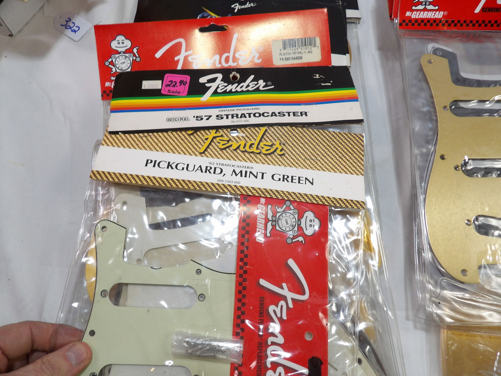 New Fender Pick Guards: 40 New Fender Pick Guards and Approximately 10 Used Fender Pick Guards. All measurements are approximate. Please see photos for condition and details. Selling as is from 04281.