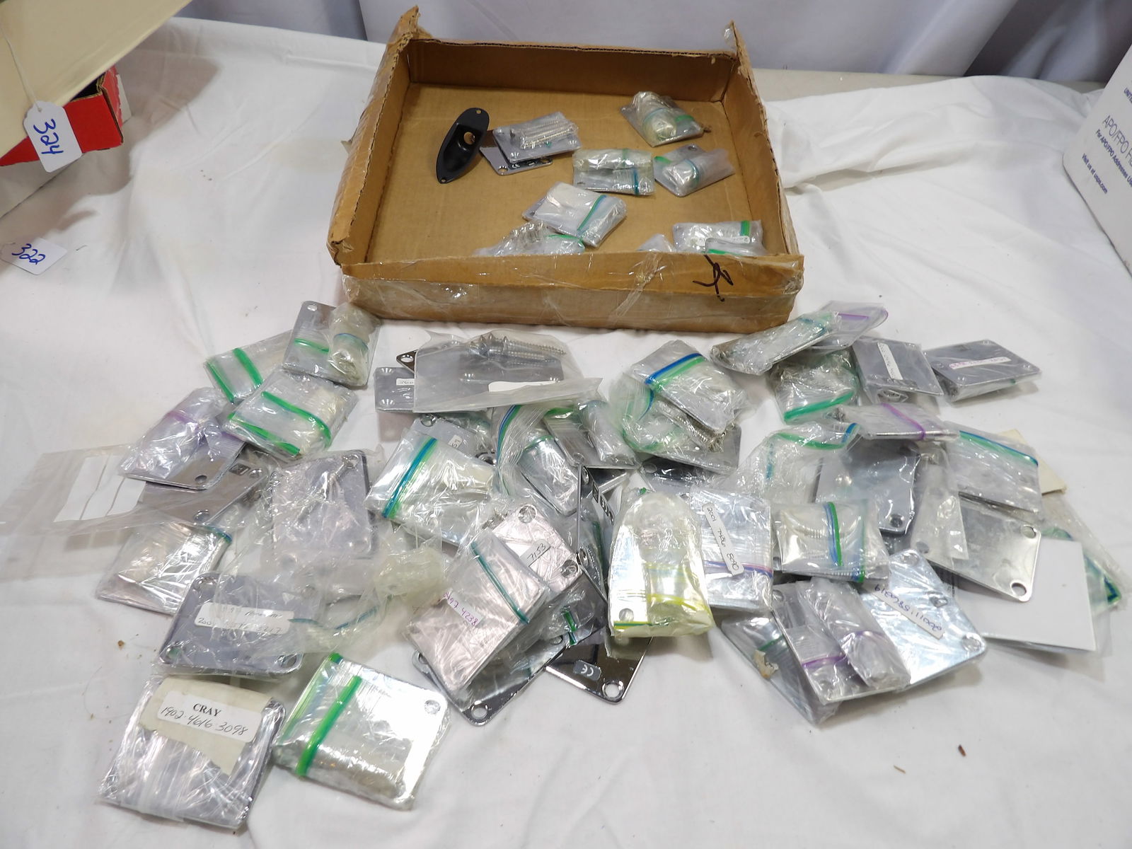 Large Lot of Fender Neck Plates: Large Lot of Fender Neck Plates. 50+/- Pieces. All measurements are approximate. Please see photos for condition and details. Selling as is from 04281.