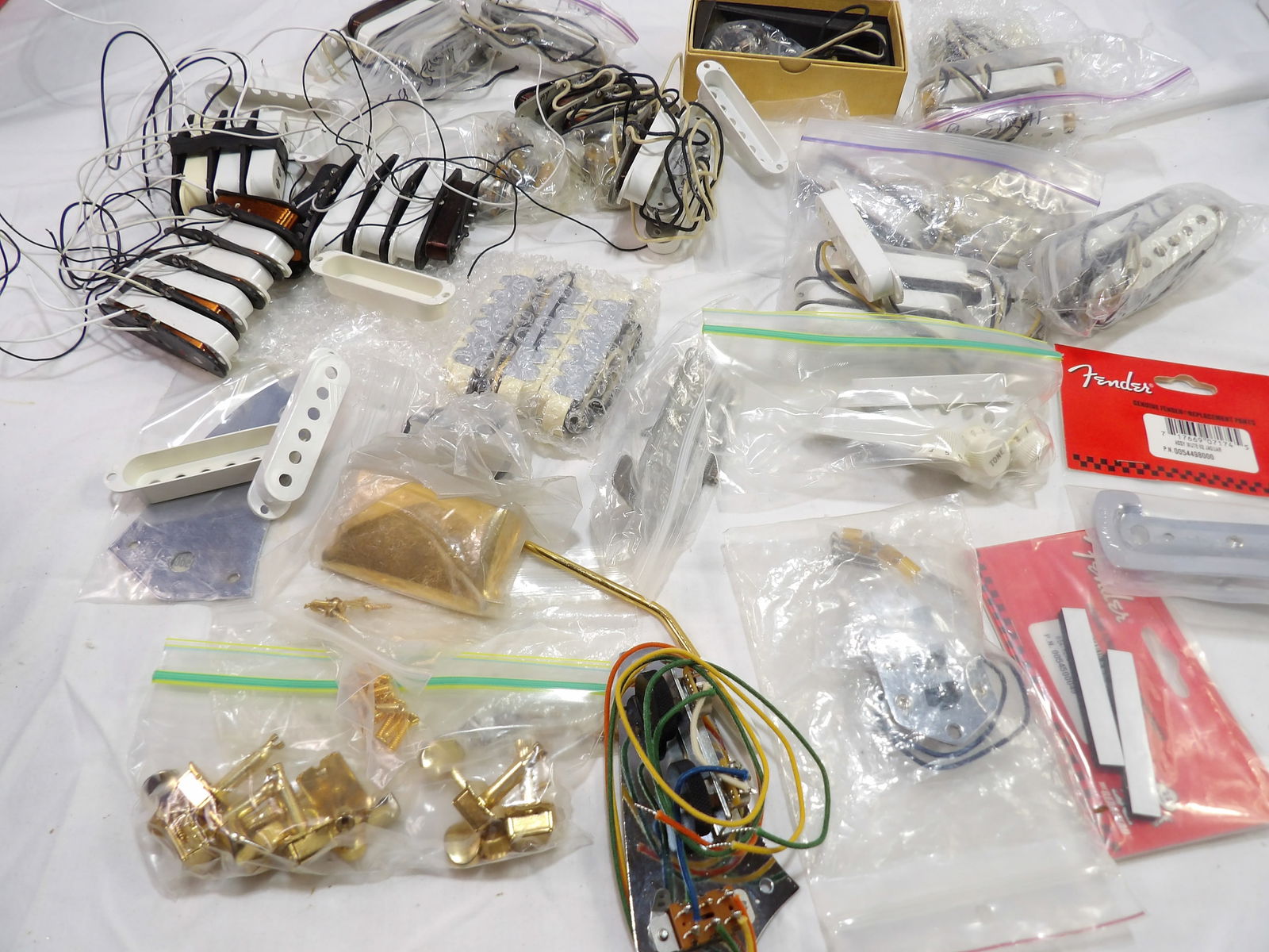 Miscellaneous Fender Parts Lot: Assorted Fender Pickups and Parts Lot. All measurements are approximate. Please see photos for condition and details. Selling as is from 04281.
