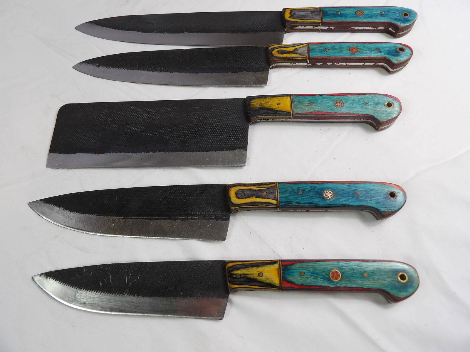 5 PCS MHS Cutlery: MHS Cutlery, Set of 5 Hand Forged Kitchen Knives. All measurements approximate. Please see photos for condition and details. Selling as is from 04281.